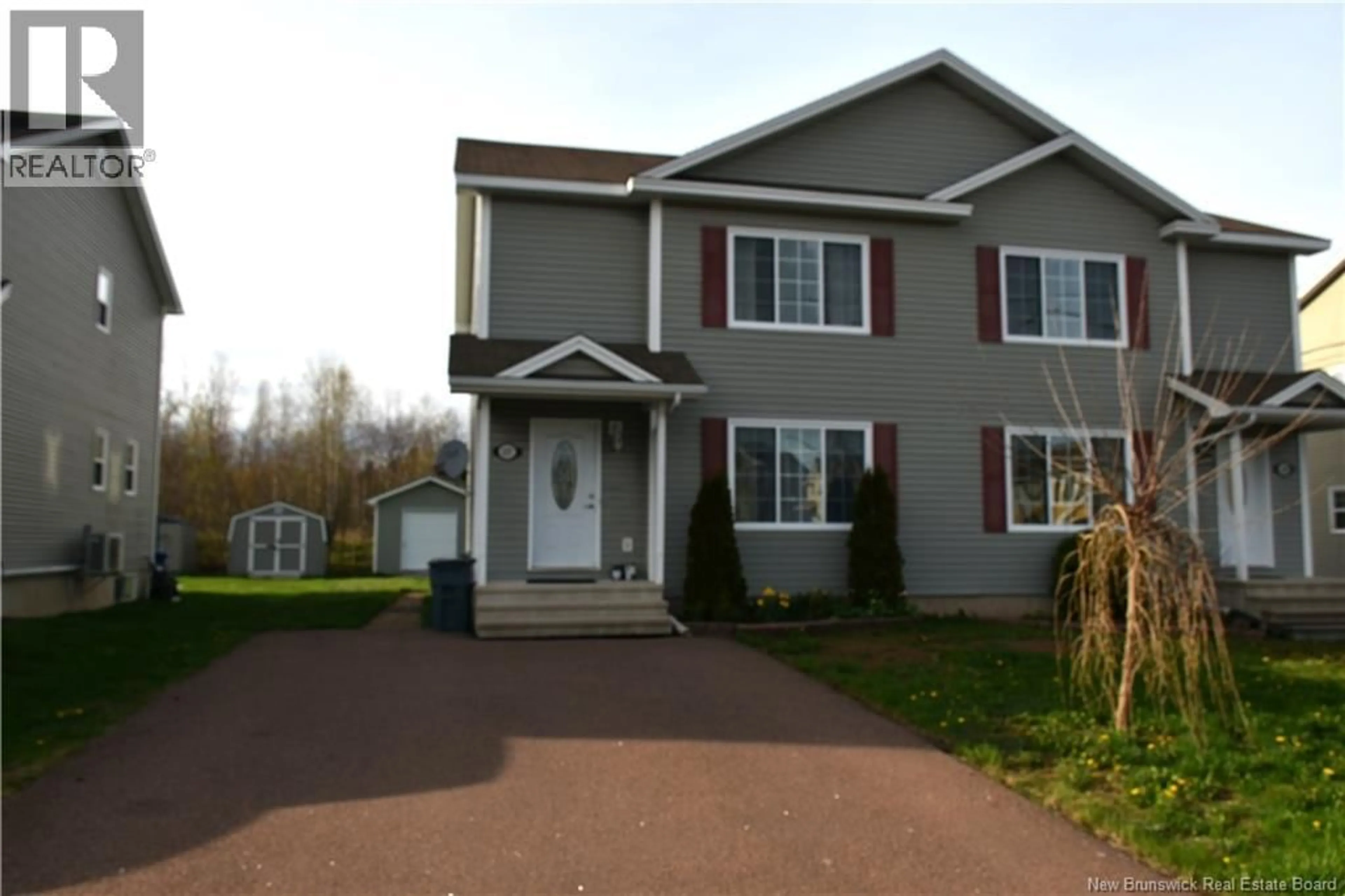 Home with vinyl exterior material, street for 137 HOULAHAN STREET, Dieppe New Brunswick E1A4X6
