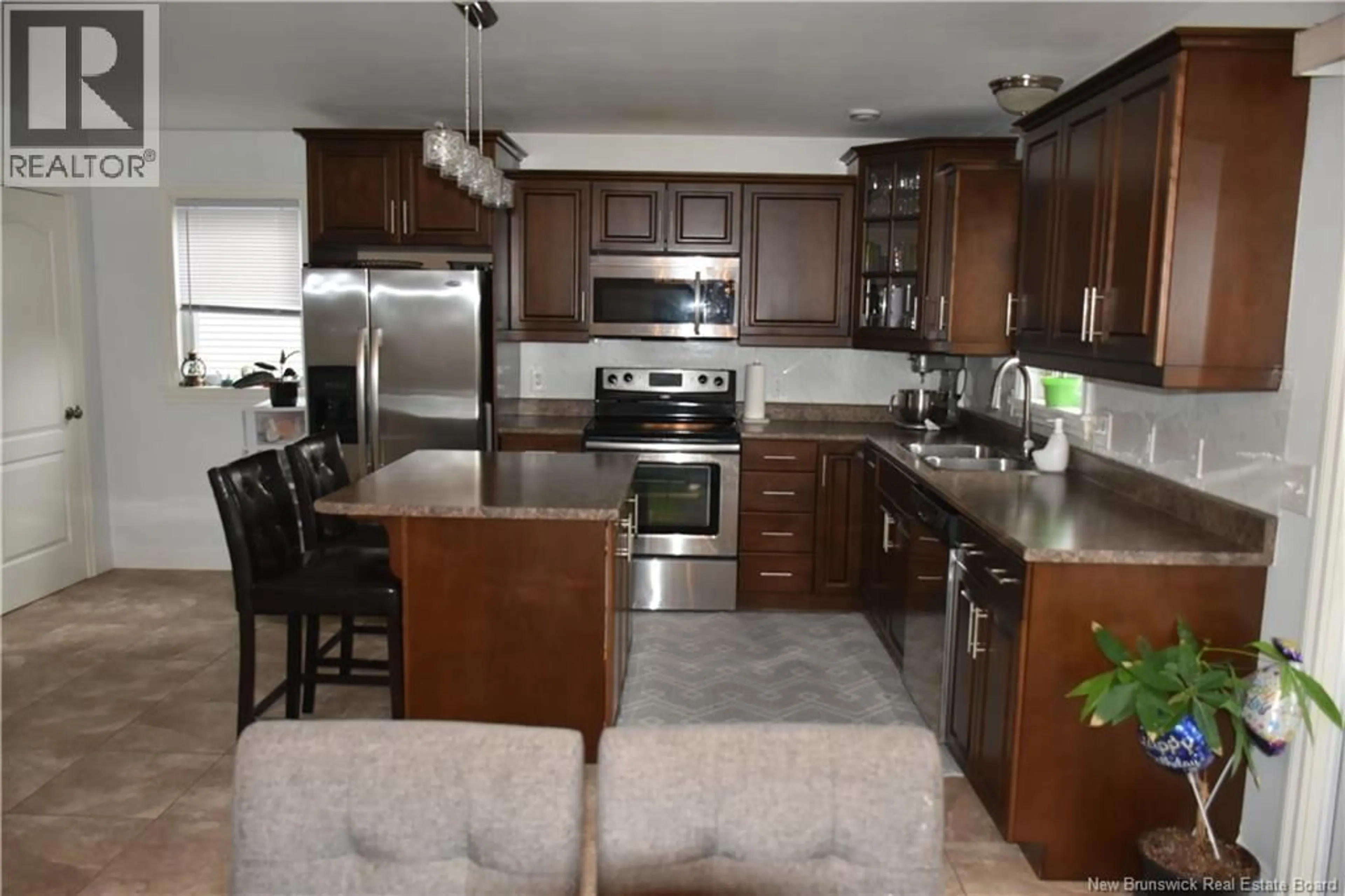Open concept kitchen, ceramic/tile floor for 137 HOULAHAN STREET, Dieppe New Brunswick E1A4X6