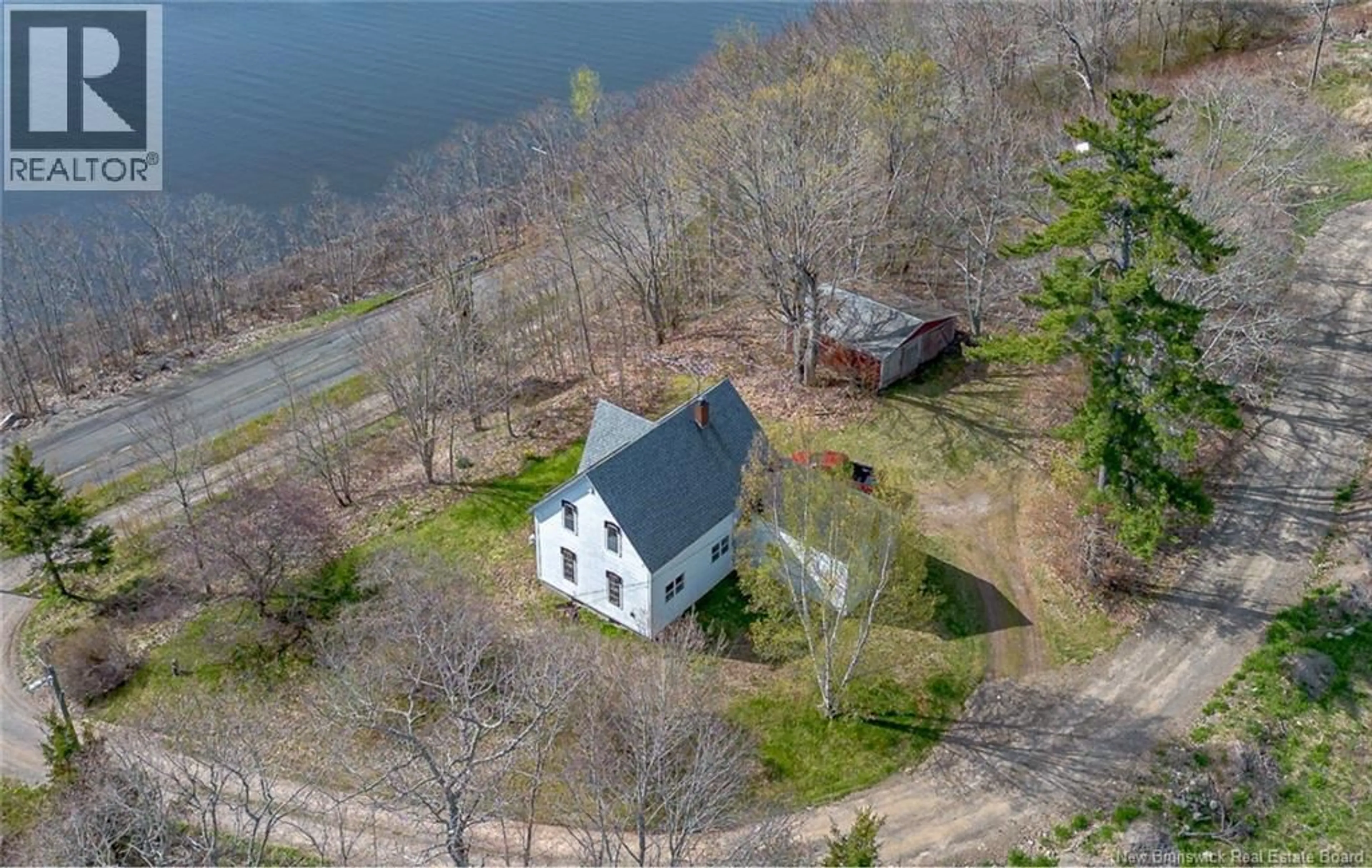 A pic from outside/outdoor area/front of a property/back of a property/a pic from drone, water/lake/river/ocean view for 6480 RTE 102, Oak Point New Brunswick E5M2G9