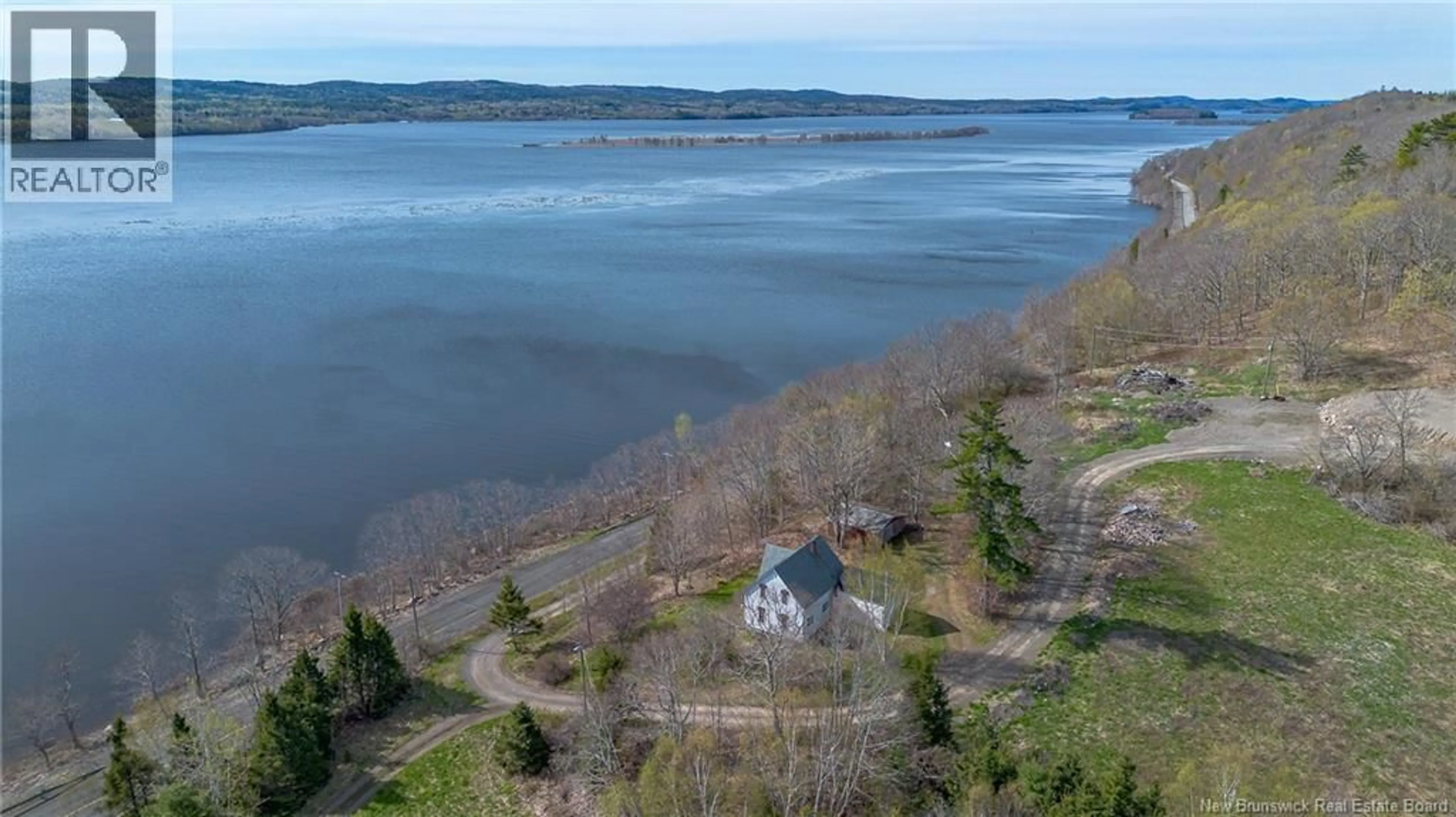 A pic from outside/outdoor area/front of a property/back of a property/a pic from drone, water/lake/river/ocean view for 6480 RTE 102, Oak Point New Brunswick E5M2G9