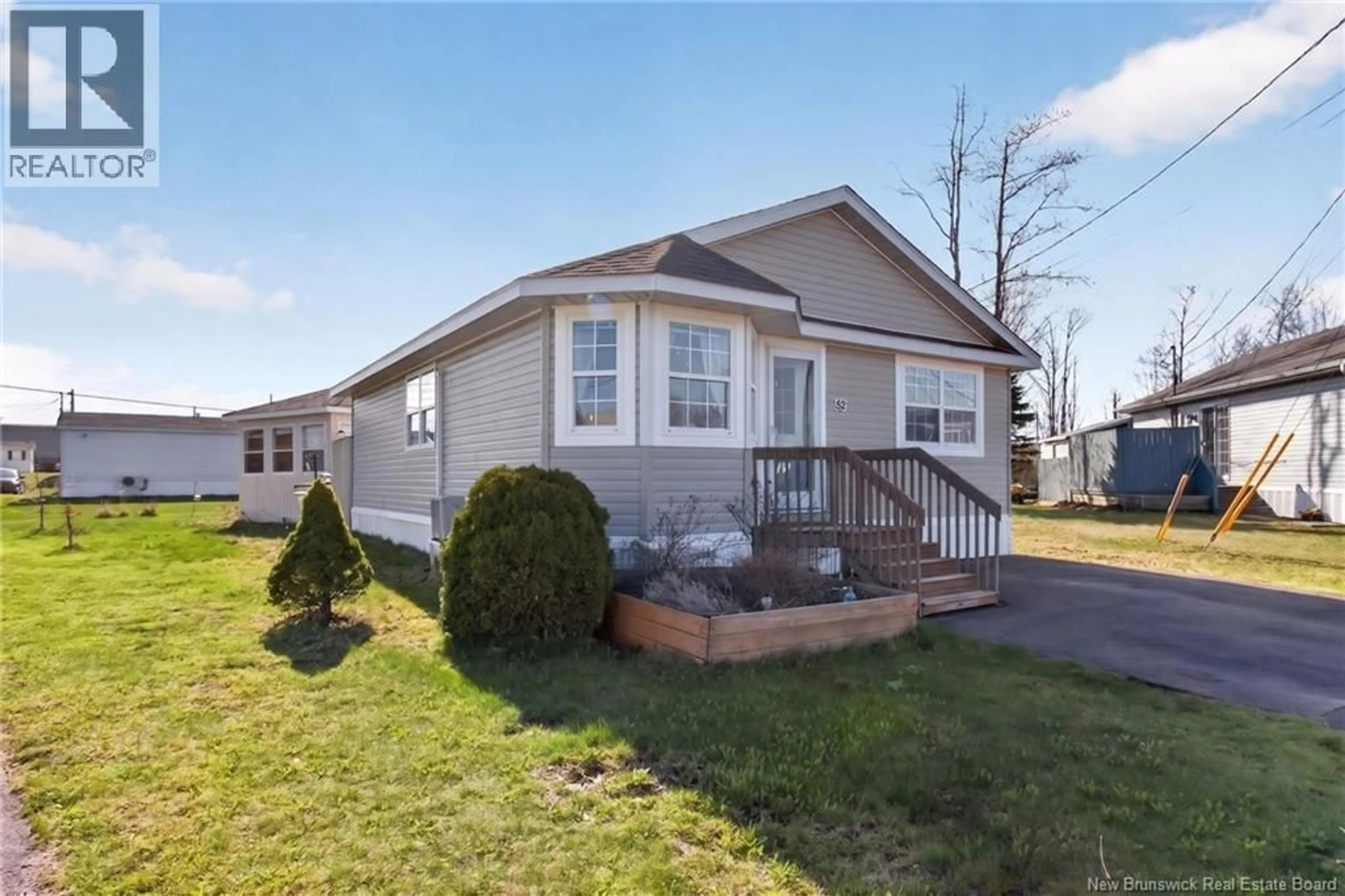 Home with vinyl exterior material, street for 52 RICHIBUCTOU LANE, Dieppe New Brunswick E1A7N1
