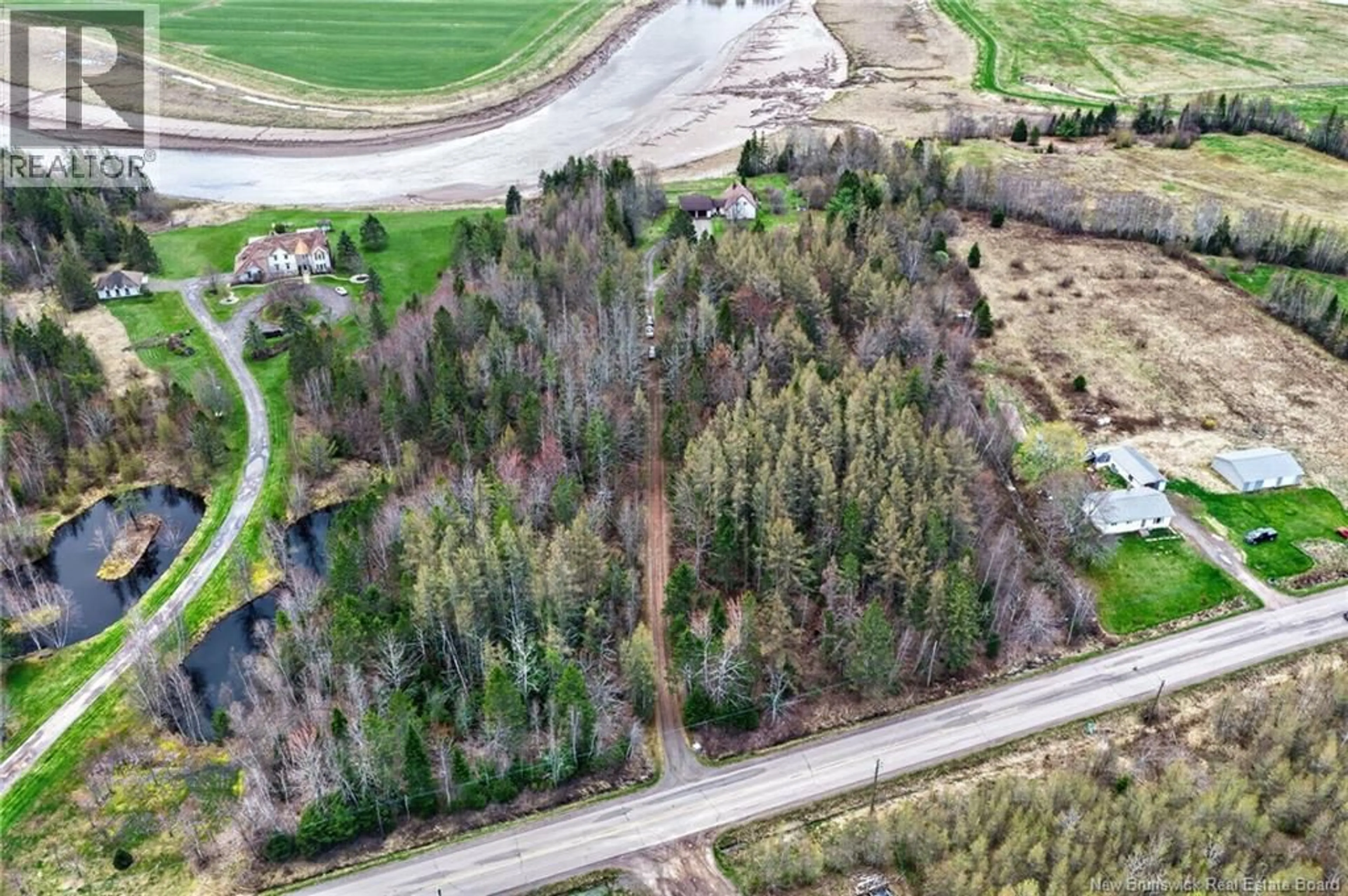 A pic from outside/outdoor area/front of a property/back of a property/a pic from drone, forest/trees view for 2402 ROUTE 106, Boundary Creek New Brunswick E1G4L8
