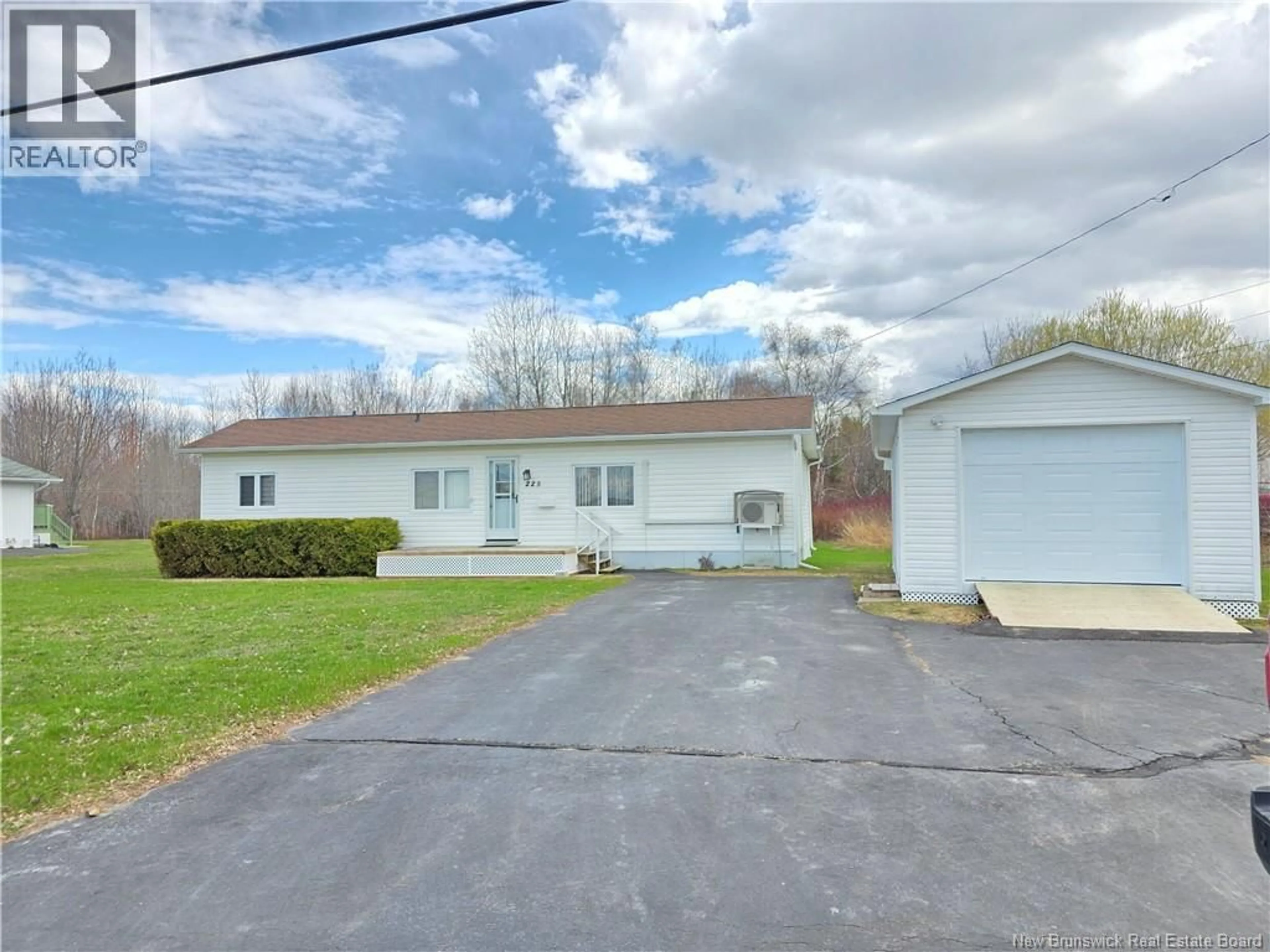 A pic from outside/outdoor area/front of a property/back of a property/a pic from drone, street for 225 PARC, Beresford New Brunswick E8K1V9