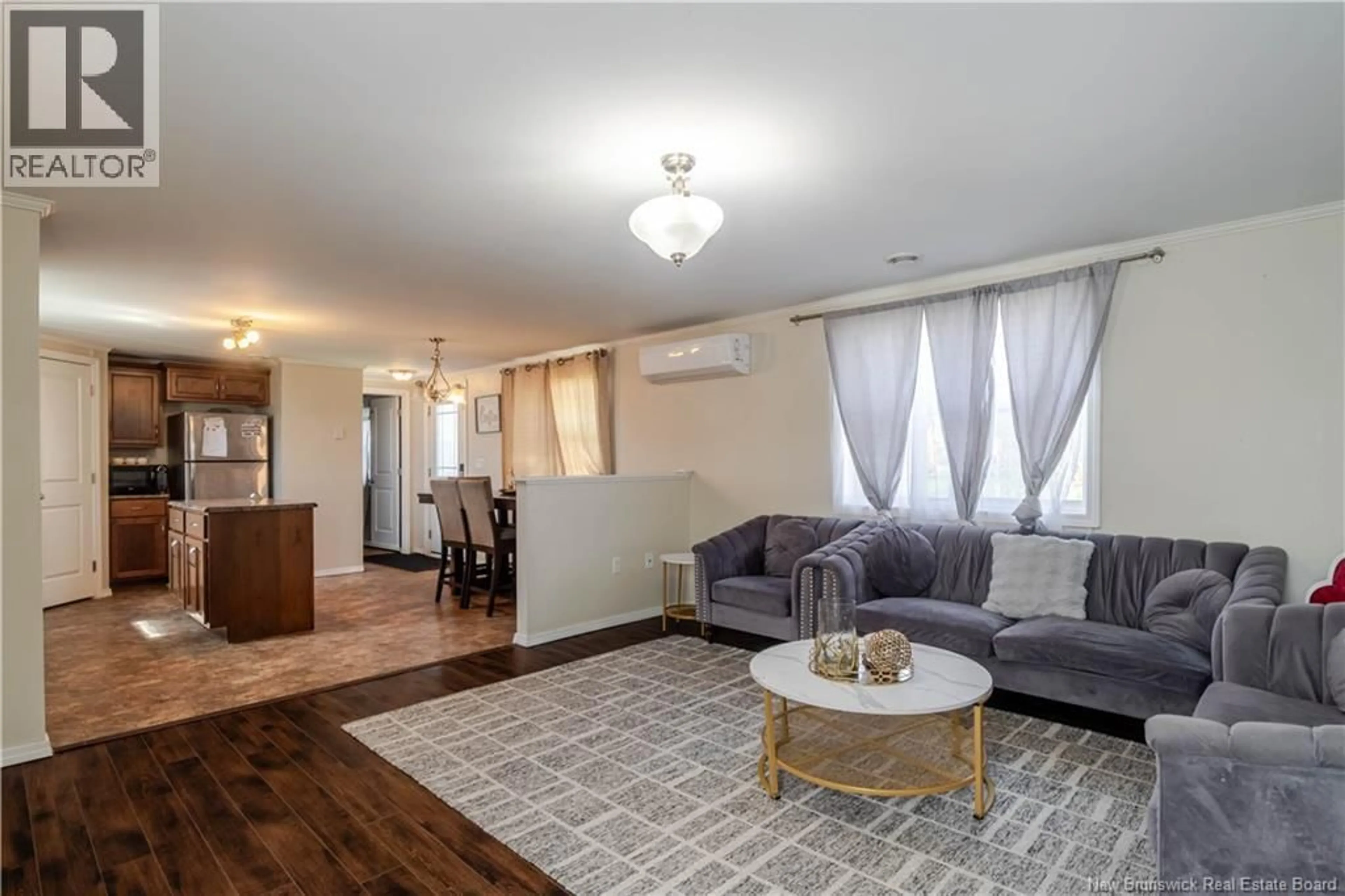 Living room with furniture, wood/laminate floor for 154 CASSIDY CIRCLE, Fredericton New Brunswick E3B7N3