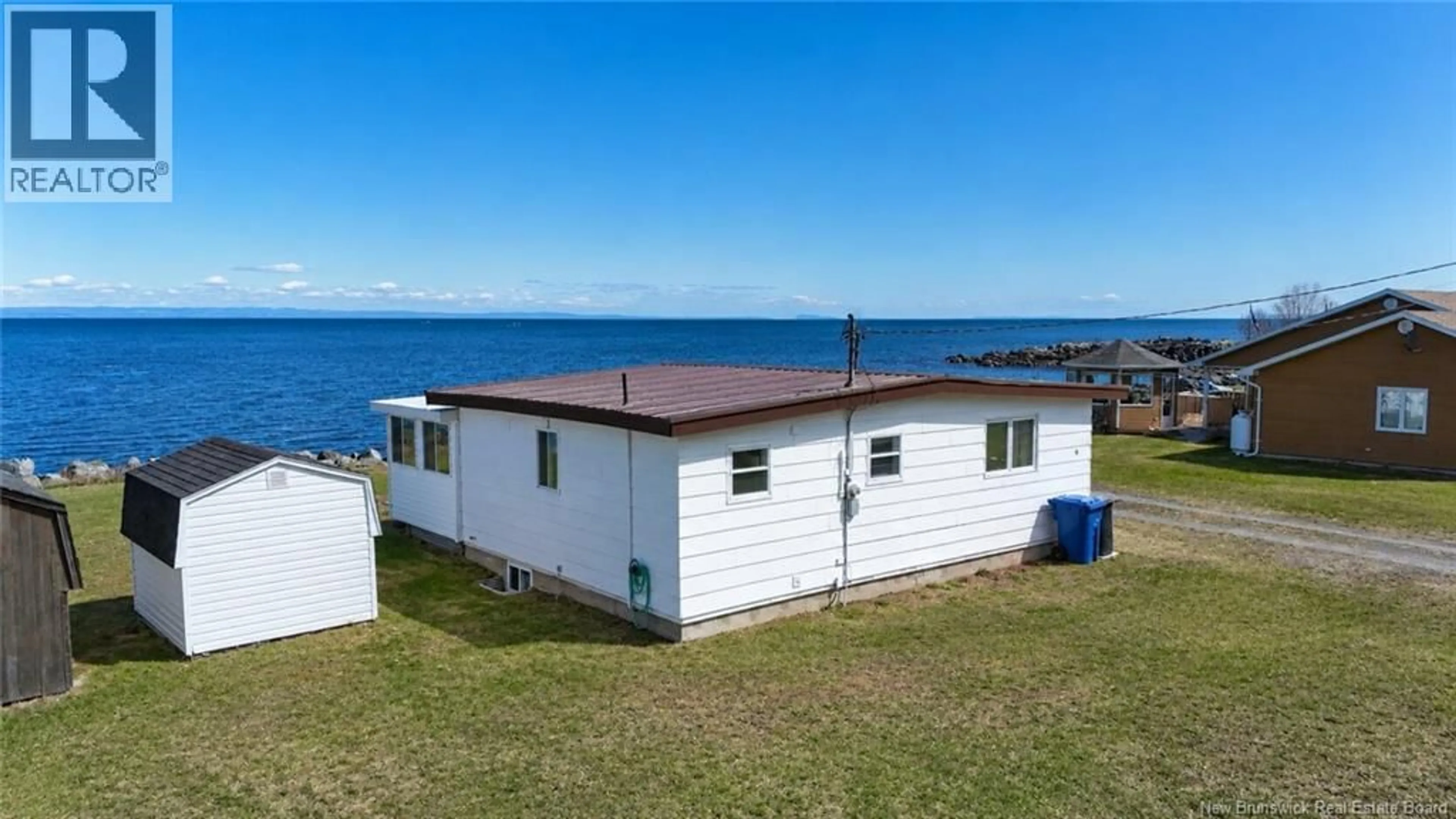 A pic from outside/outdoor area/front of a property/back of a property/a pic from drone, water/lake/river/ocean view for 9 DE L'ANSE EST, Pointe-Verte New Brunswick E8J3A7
