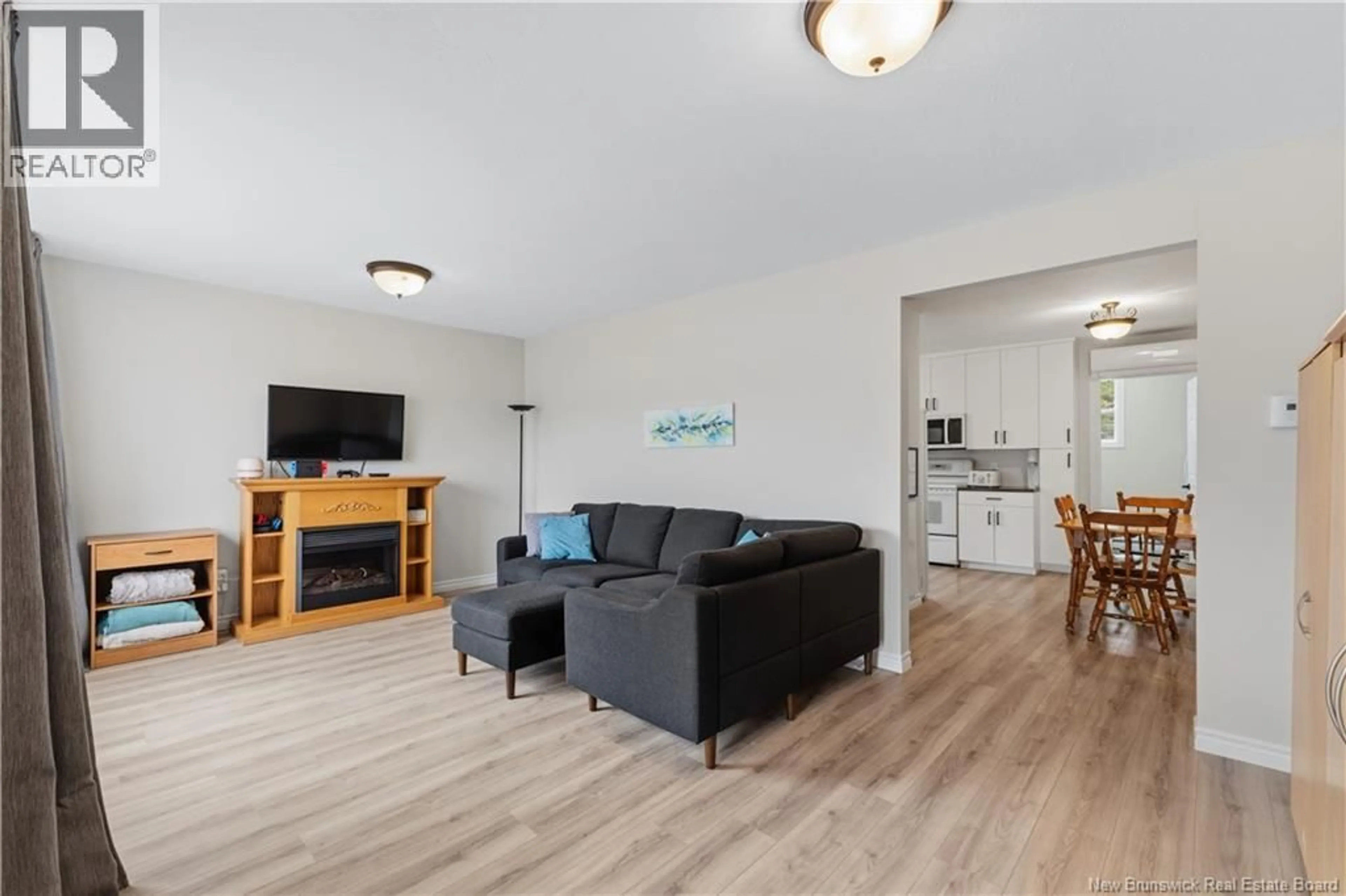 Living room with furniture, wood/laminate floor for 6 PARKER RD, Scoudouc New Brunswick E4P3P9