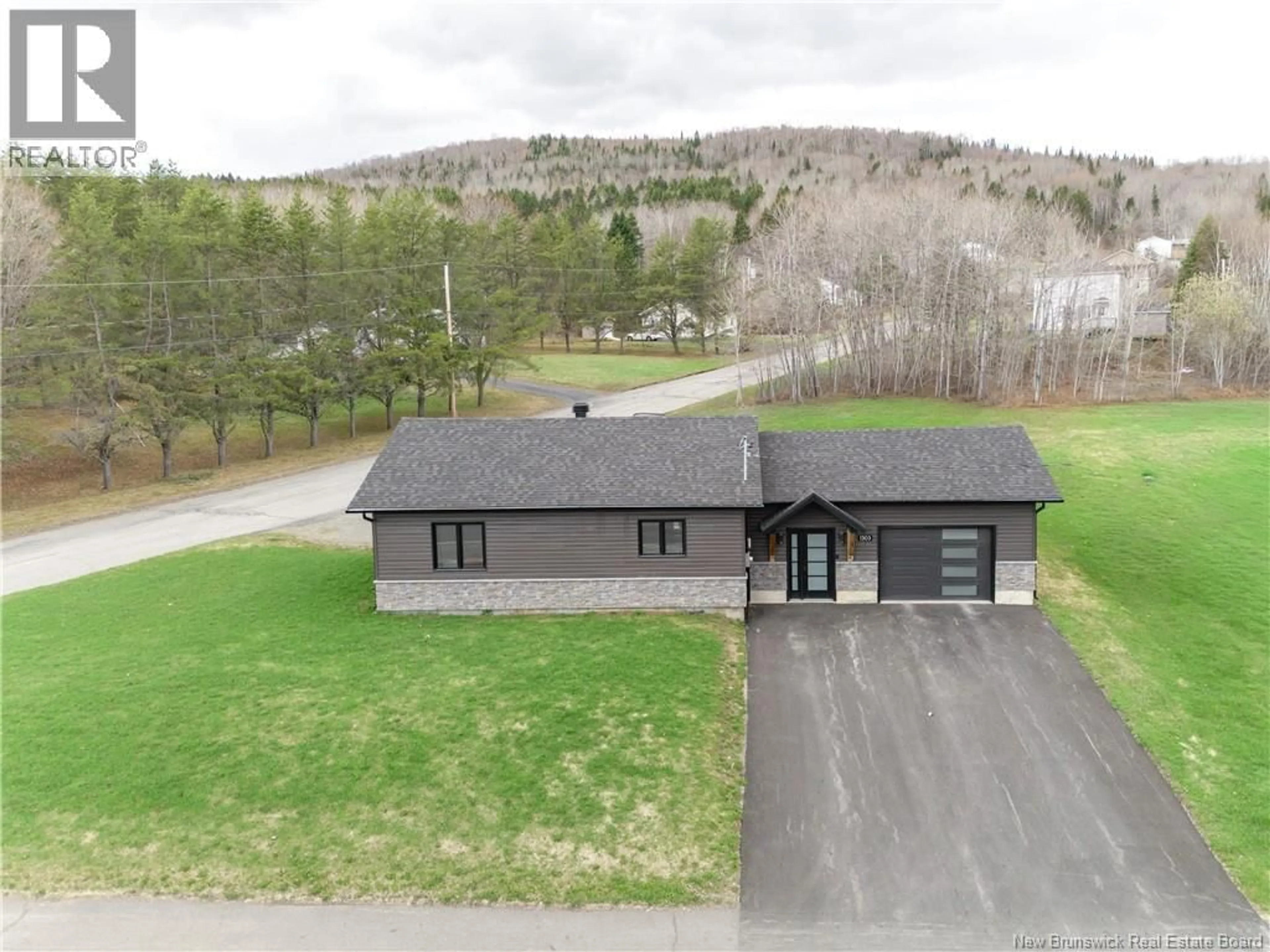 A pic from outside/outdoor area/front of a property/back of a property/a pic from drone, unknown for 1303 ST-FRANCOIS, Edmundston New Brunswick E3V4P2