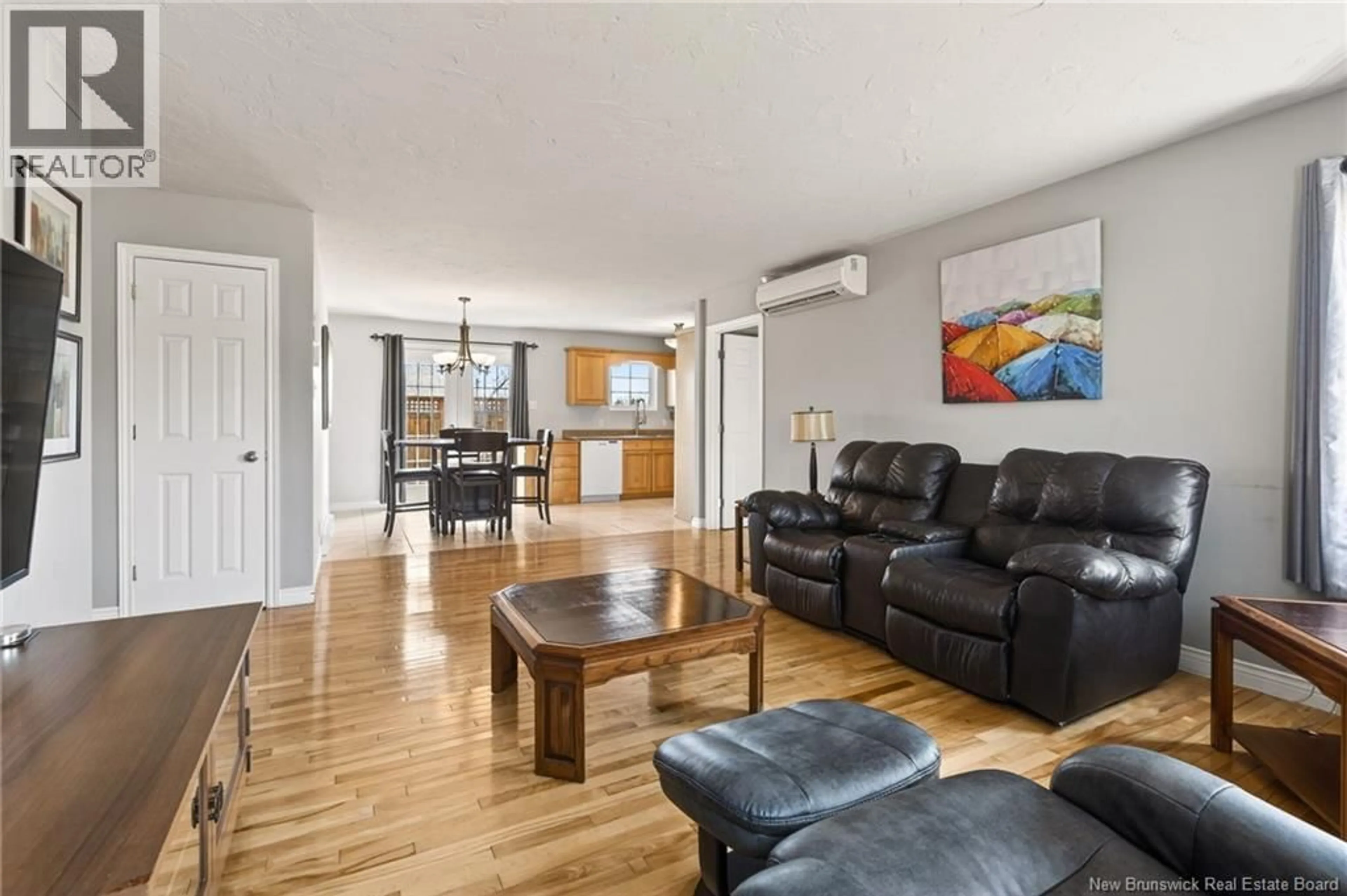Living room with furniture, wood/laminate floor for 51 PELAGIE STREET, Dieppe New Brunswick E1A7R6
