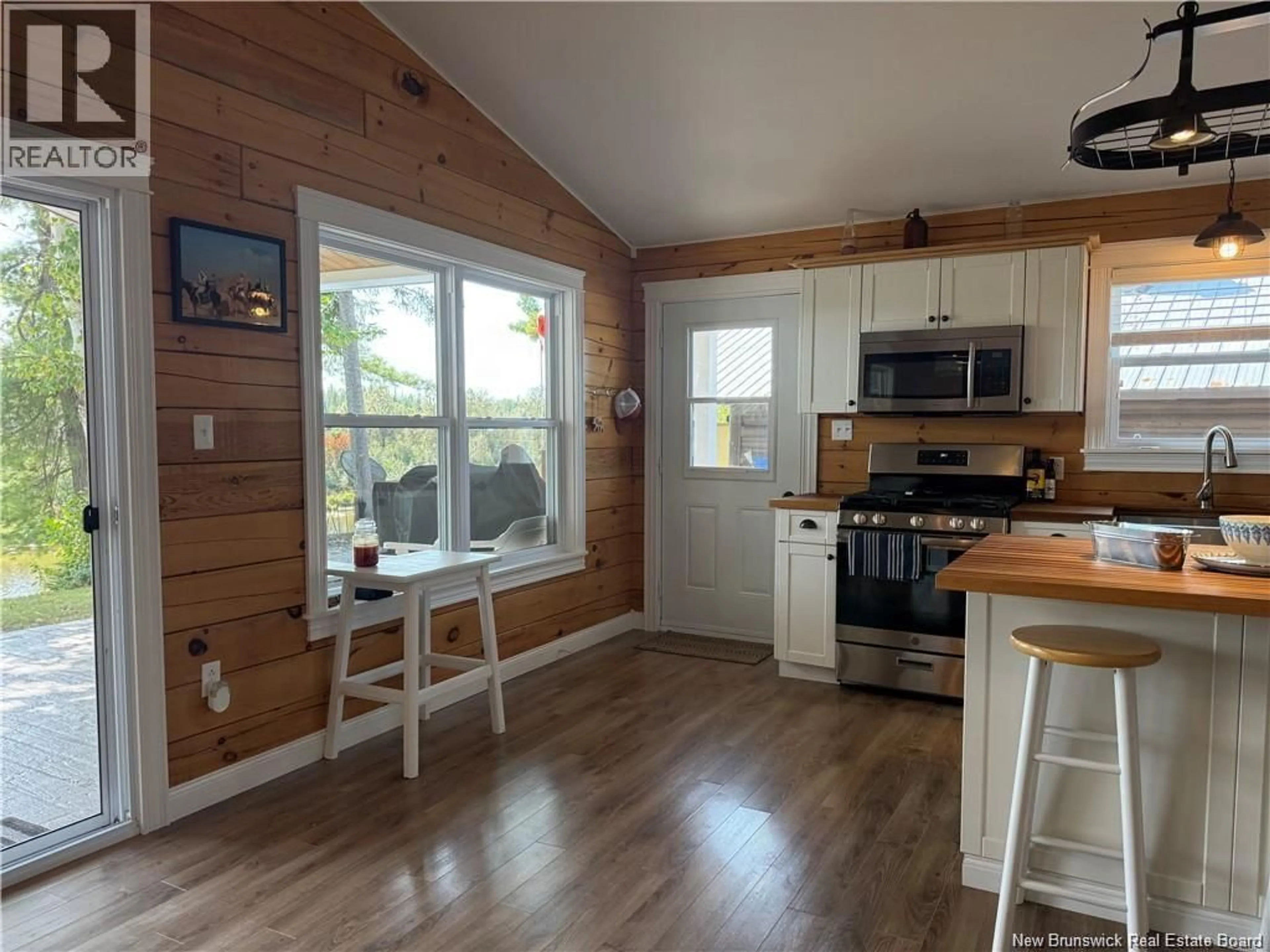 Open concept kitchen, wood/laminate floor for 20 ROBERTSON LANE, Burntland Brook New Brunswick E7G3M2