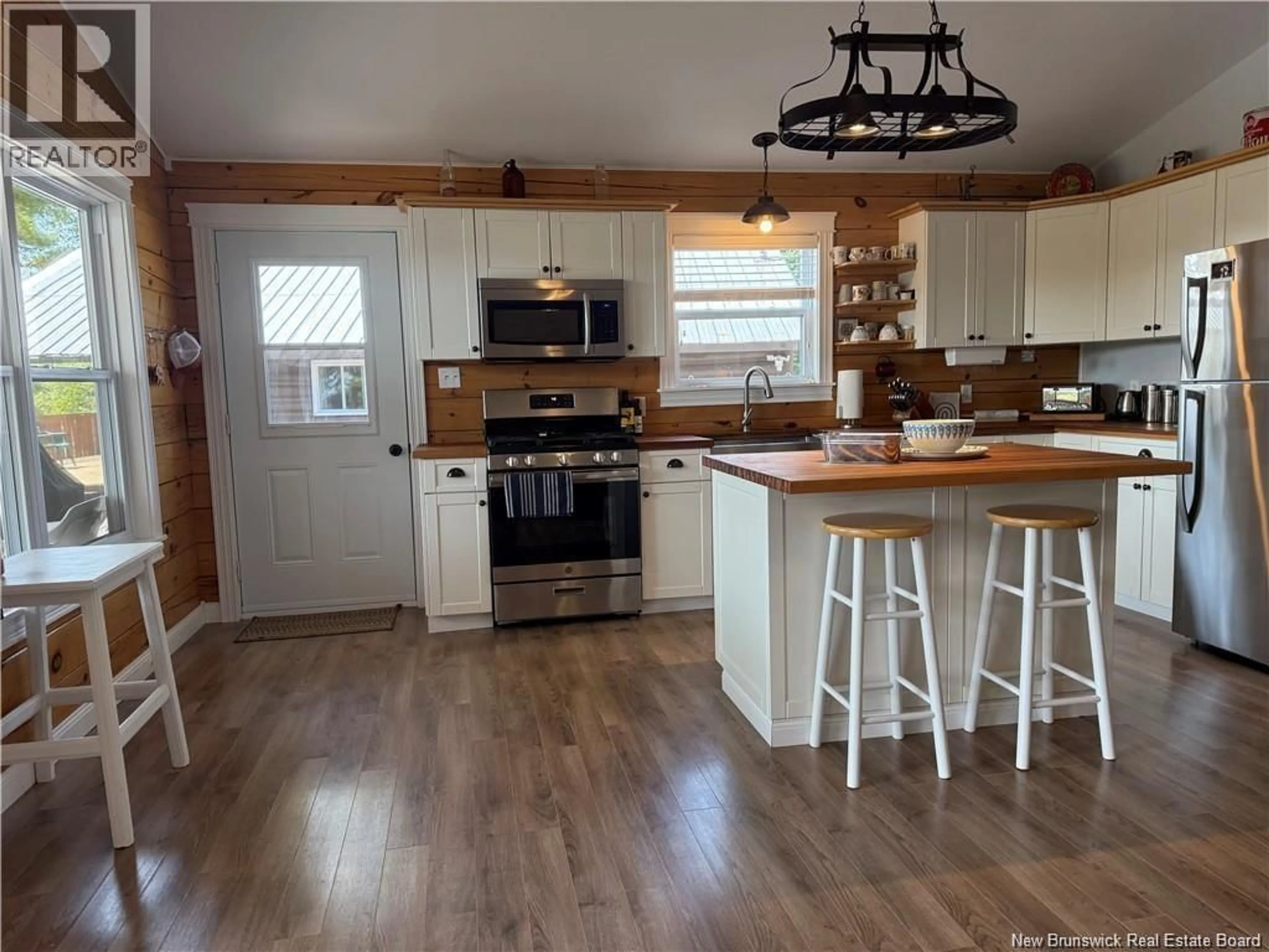 Open concept kitchen, wood/laminate floor for 20 ROBERTSON LANE, Burntland Brook New Brunswick E7G3M2