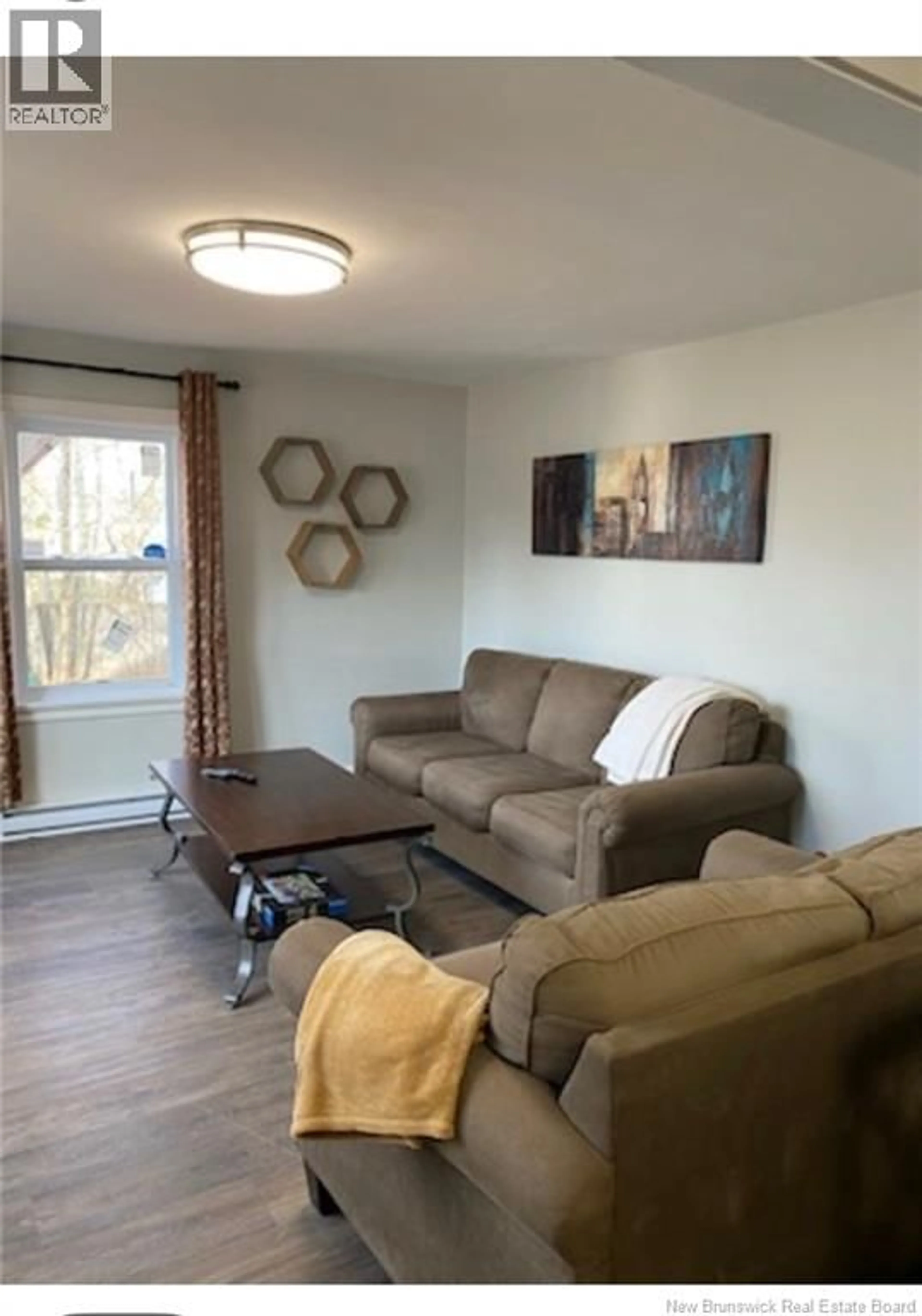 Living room with furniture, wood/laminate floor for 525 ACADIE, Dieppe New Brunswick E1A1J2