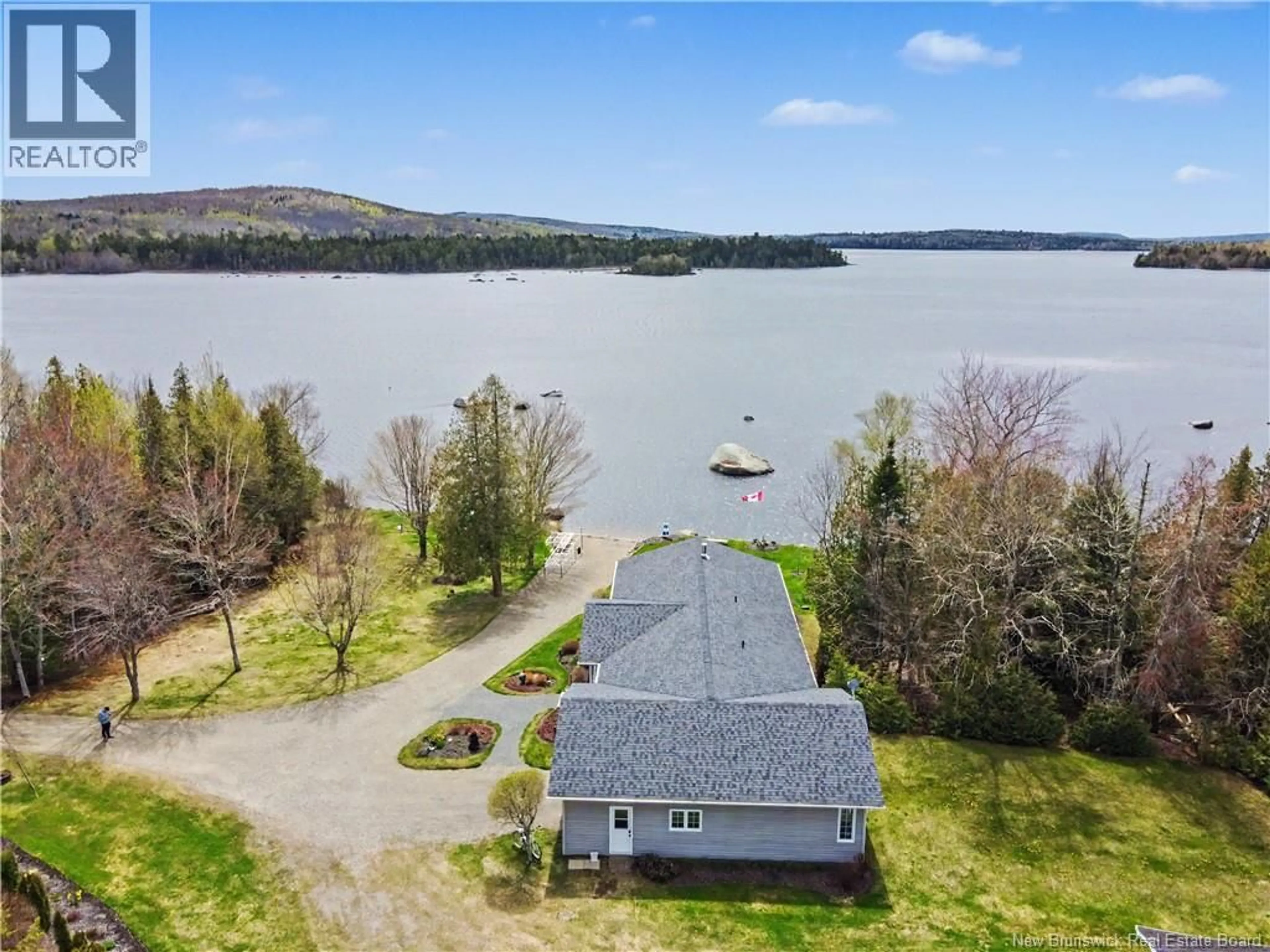 A pic from outside/outdoor area/front of a property/back of a property/a pic from drone, water/lake/river/ocean view for 49 FARRELL LANE, North Lake New Brunswick E6H2E3