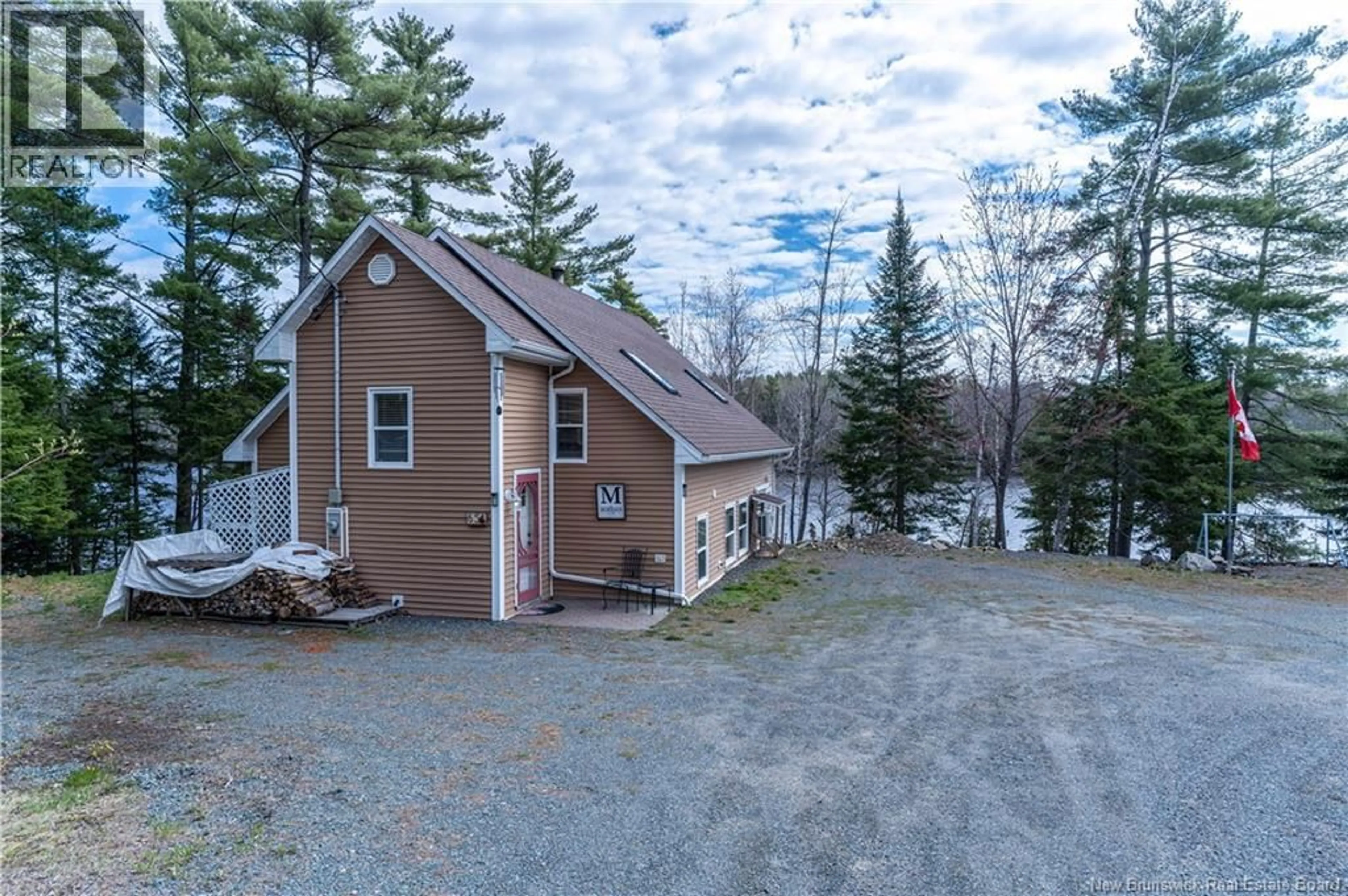 A pic from outside/outdoor area/front of a property/back of a property/a pic from drone, water/lake/river/ocean view for 65 JOHNSON ROAD, Miramichi New Brunswick E1V7H1