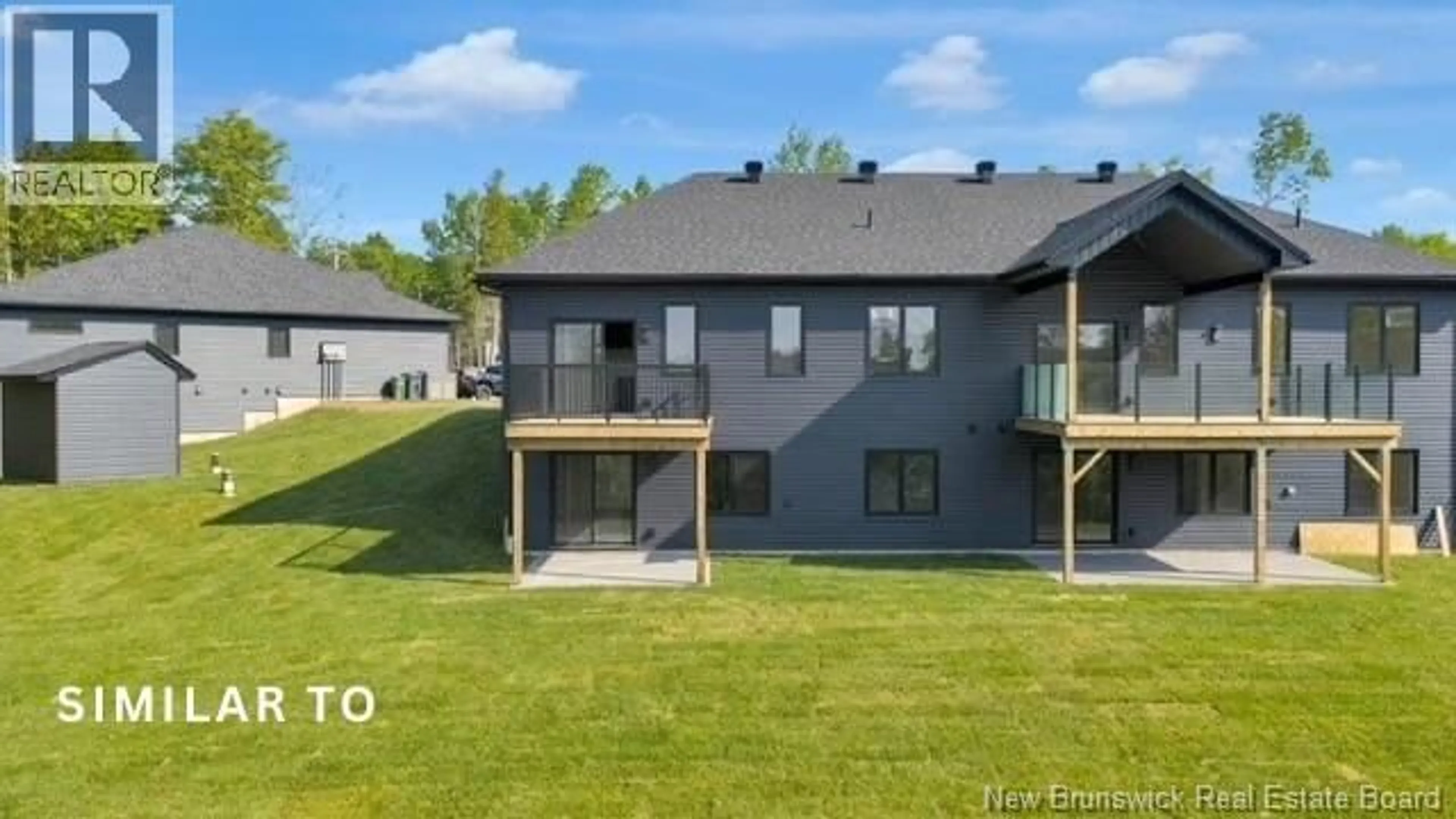 A pic from outside/outdoor area/front of a property/back of a property/a pic from drone, unknown for 13 - 22 WETMORE BOULEVARD, Quispamsis New Brunswick E2E0Y9