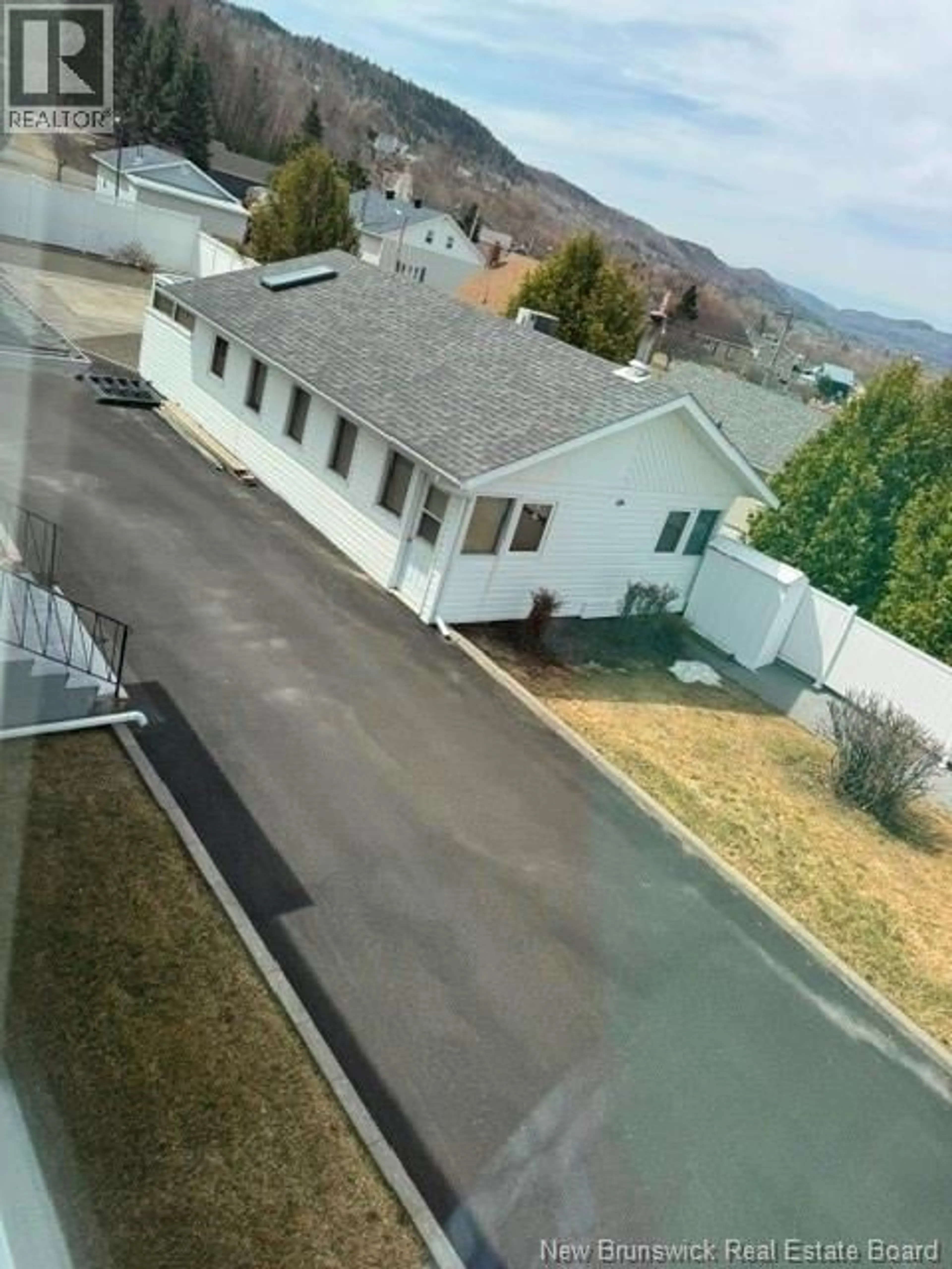 A pic from outside/outdoor area/front of a property/back of a property/a pic from drone, mountain view for 64 FAIRVIEW STREET, Atholville New Brunswick E3N4L3