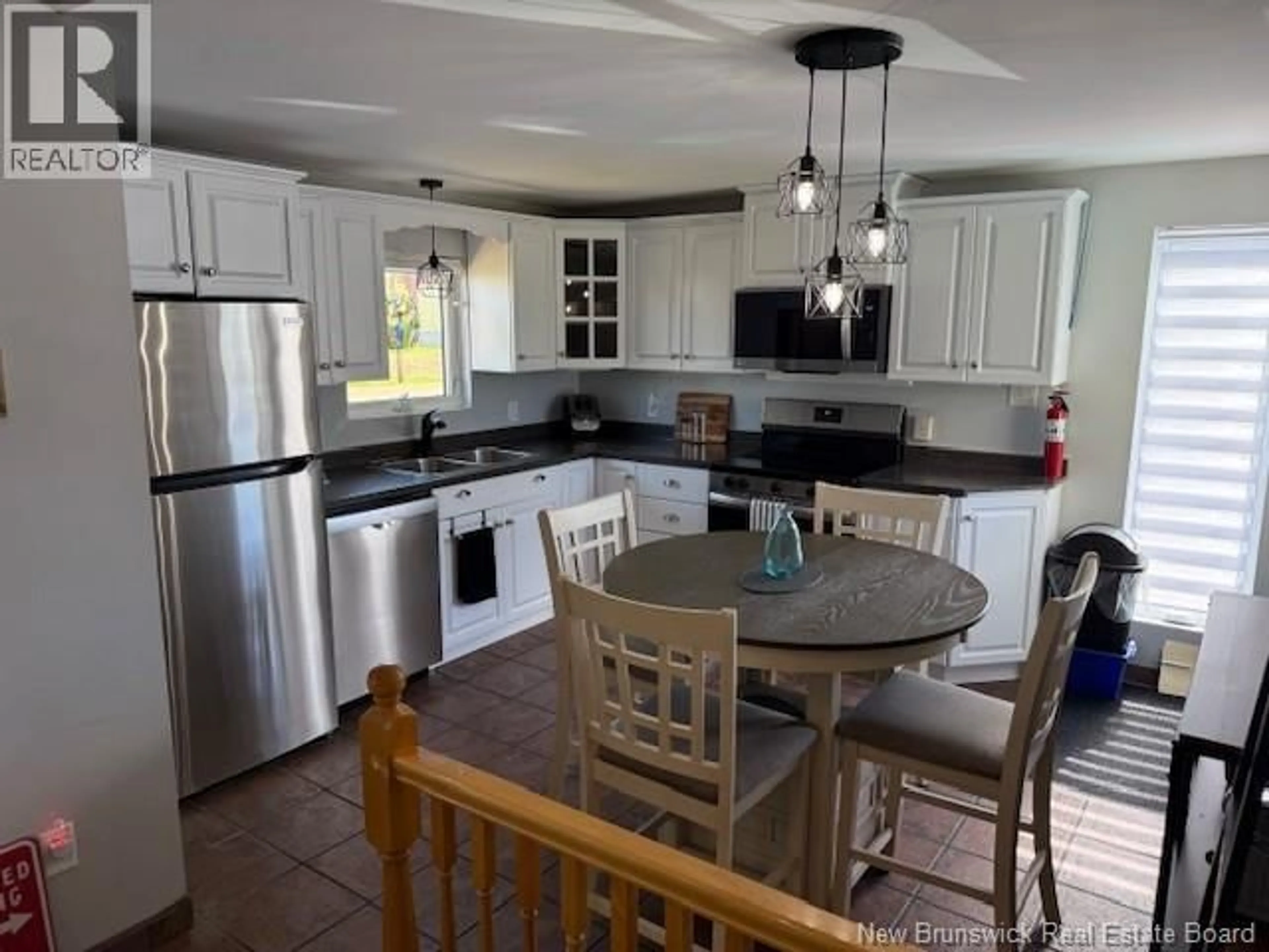 Open concept kitchen, ceramic/tile floor for 10 SIVRET STREET, Charlo New Brunswick E8E2S5