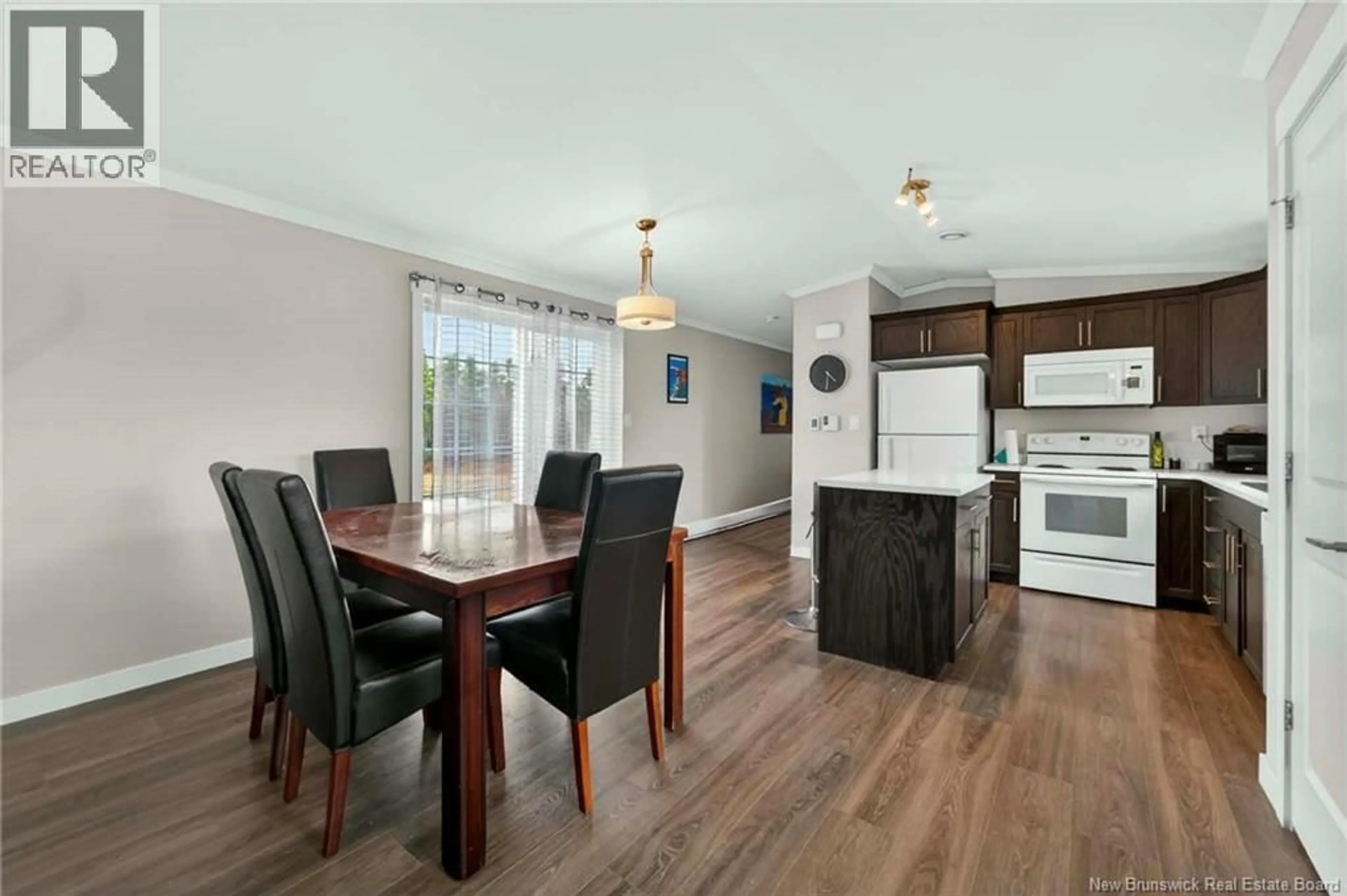 Open concept kitchen, wood/laminate floor for 44 CRANBROOK, Riverview New Brunswick E1B0N6