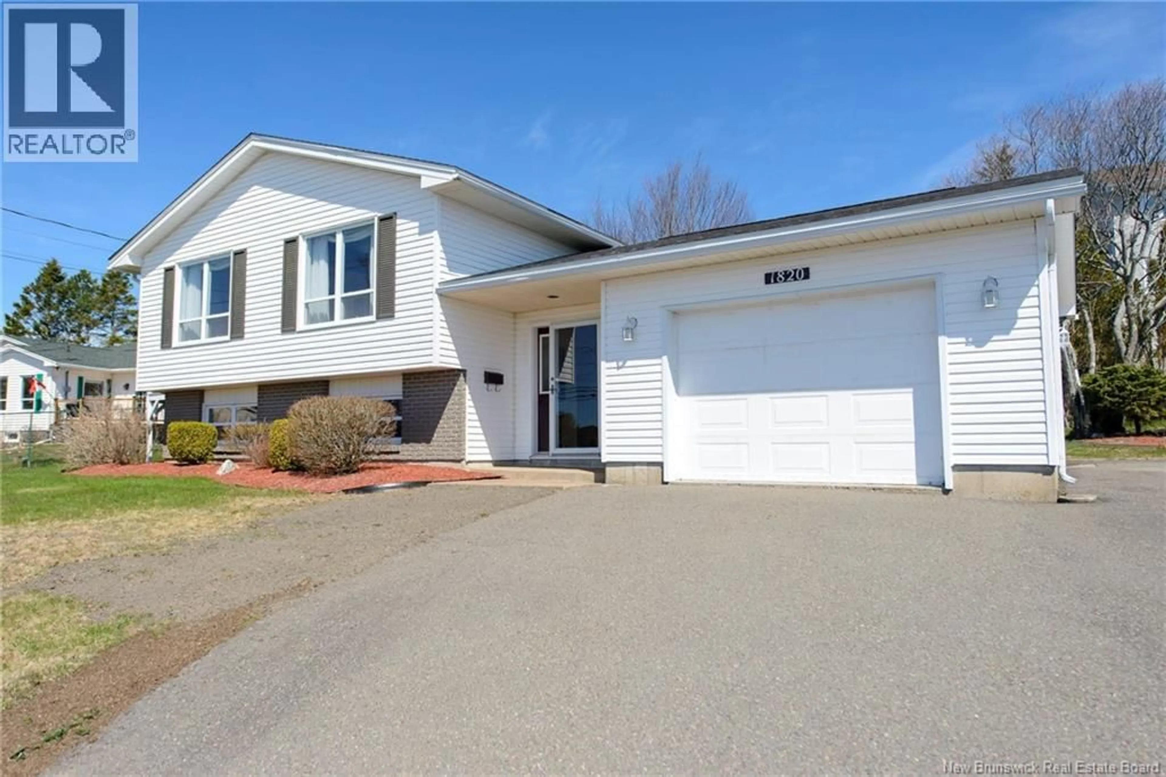 Home with vinyl exterior material, street for 1820 MANAWAGONISH ROAD, Saint John New Brunswick E2M3Y5