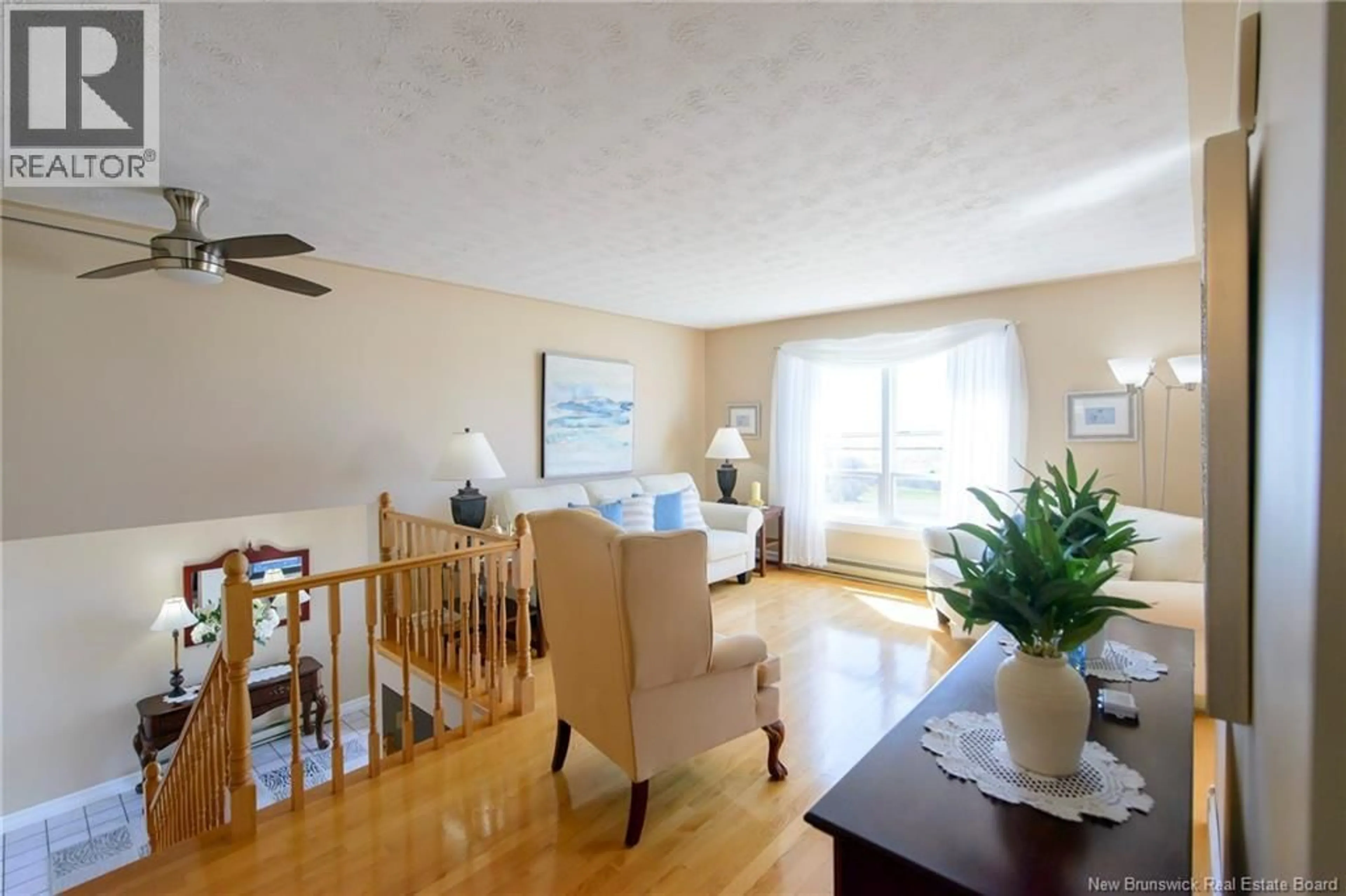 Living room with furniture, wood/laminate floor for 1820 MANAWAGONISH ROAD, Saint John New Brunswick E2M3Y5