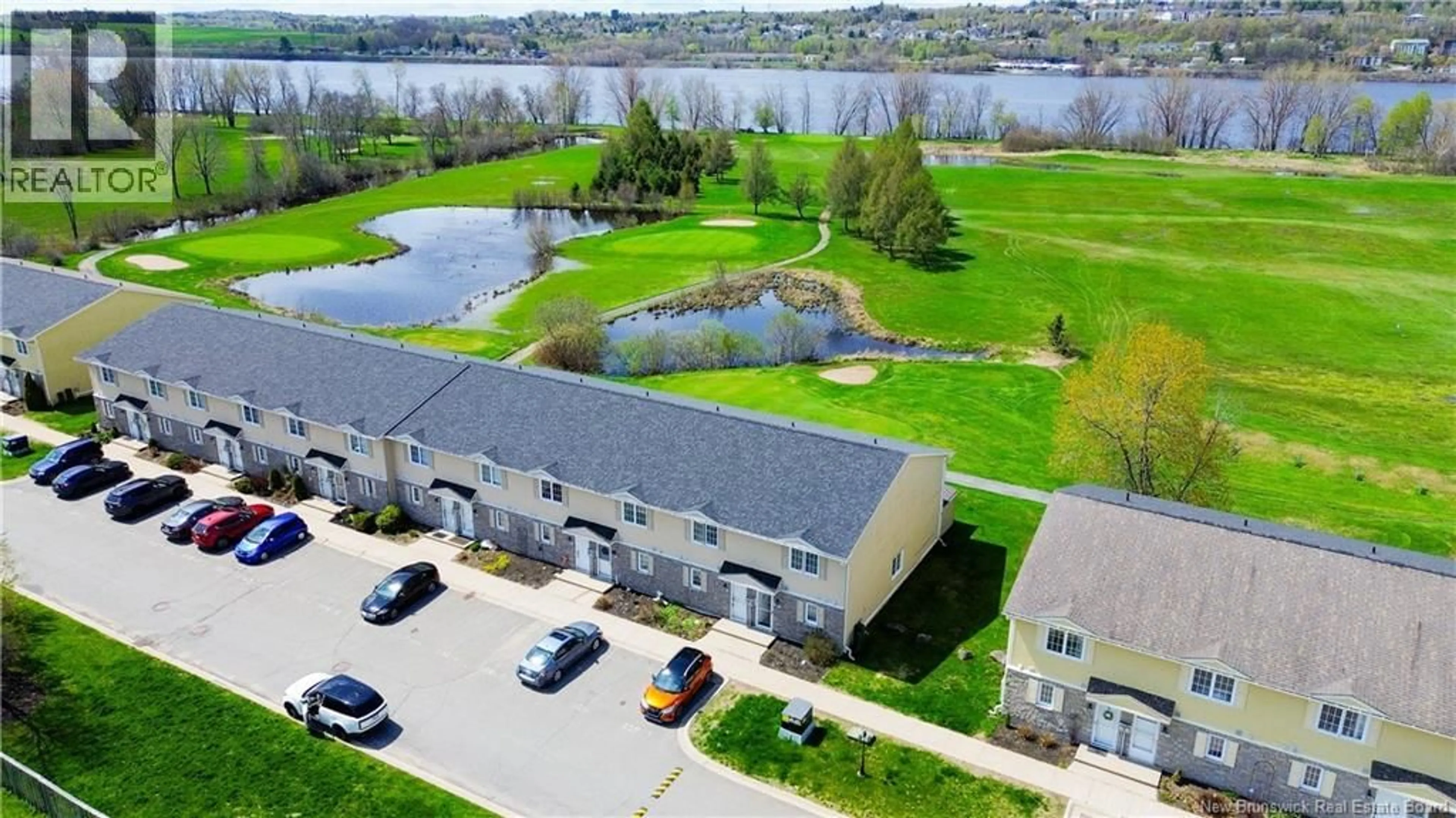 A pic from outside/outdoor area/front of a property/back of a property/a pic from drone, water/lake/river/ocean view for 1 - 508 RIVERSIDE DRIVE, Fredericton New Brunswick E3A8C2