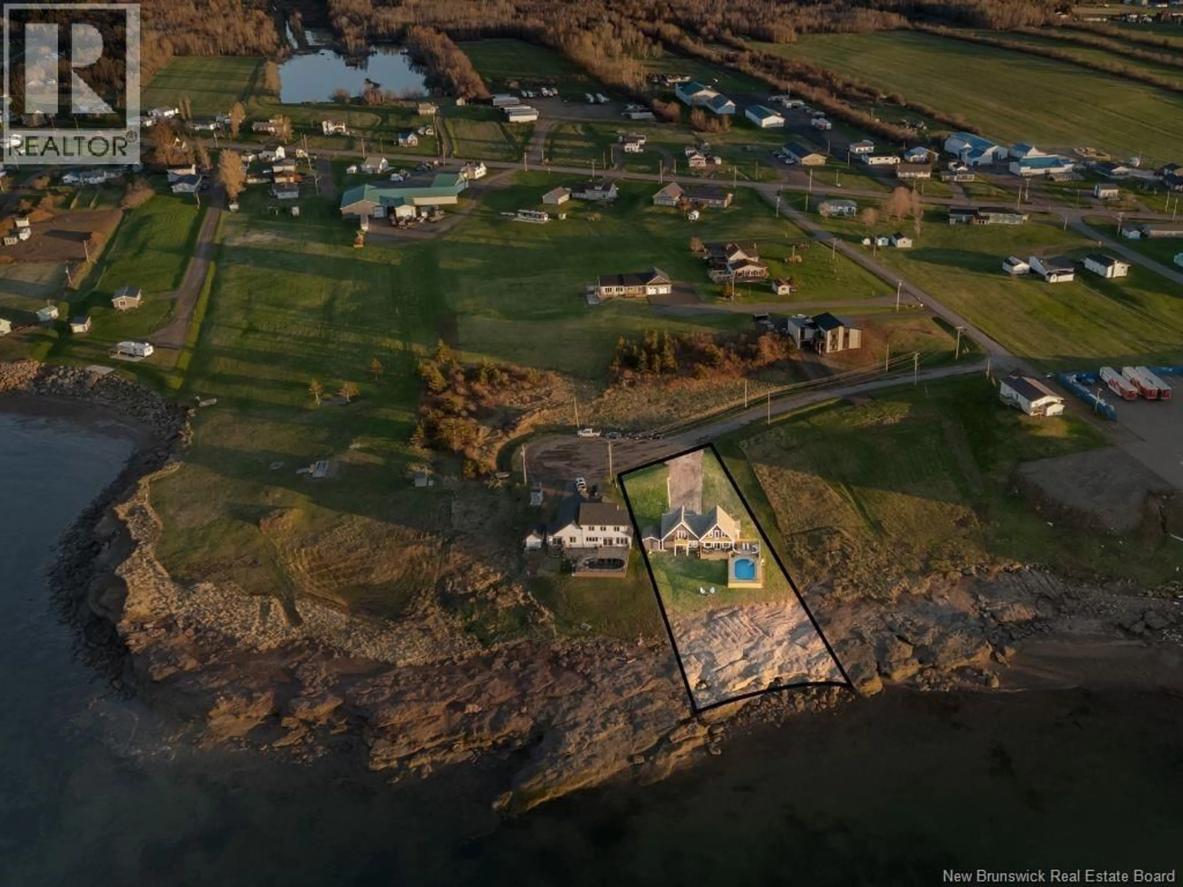 A pic from outside/outdoor area/front of a property/back of a property/a pic from drone, water/lake/river/ocean view for 12 MACON LANE, Cap-Pelé New Brunswick E4P1X2