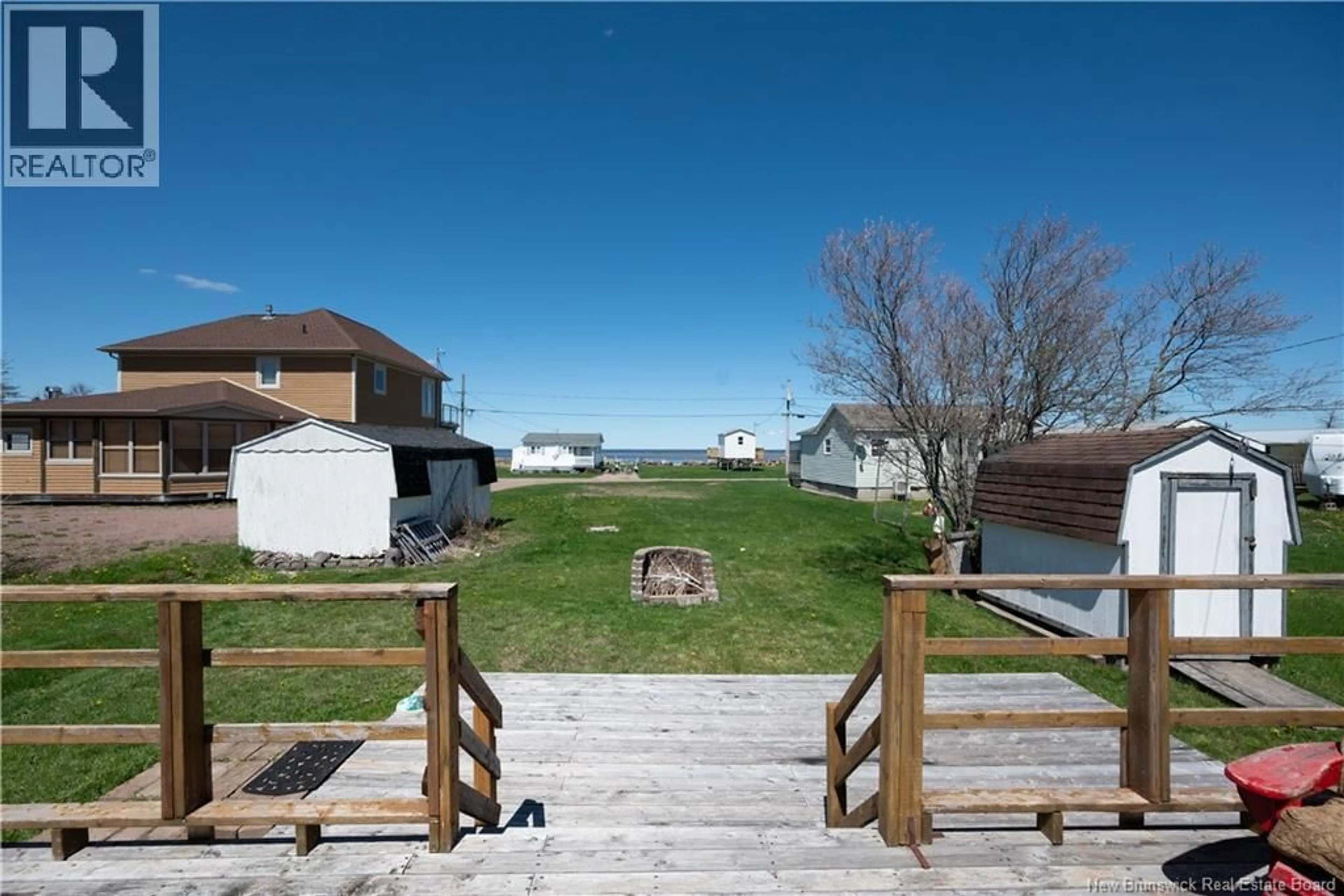 A pic from outside/outdoor area/front of a property/back of a property/a pic from drone, water/lake/river/ocean view for 5 STE-MARIE STREET, Grand-Barachois New Brunswick E4P8N4