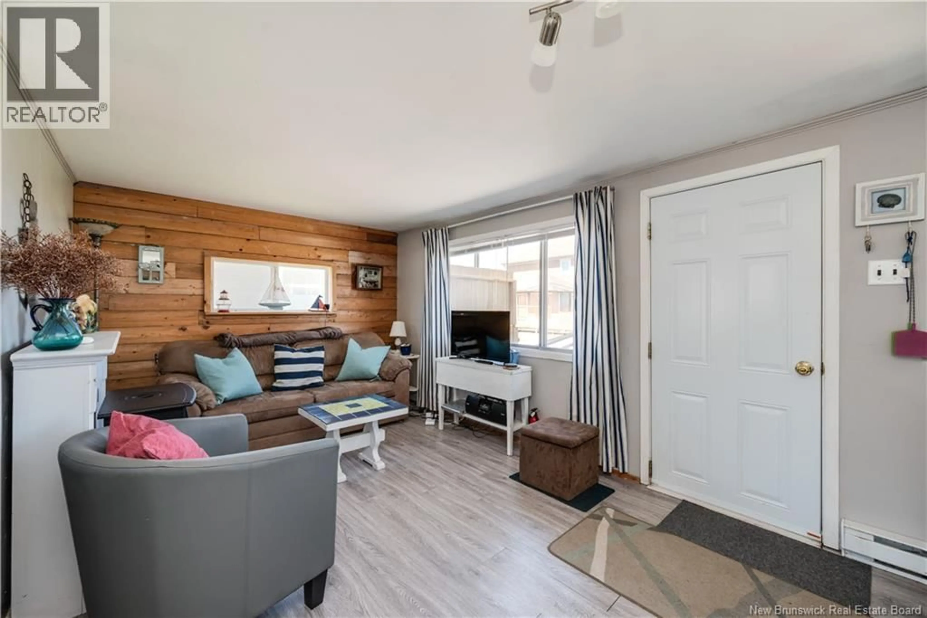 Living room with furniture, wood/laminate floor for 5 STE-MARIE STREET, Grand-Barachois New Brunswick E4P8N4