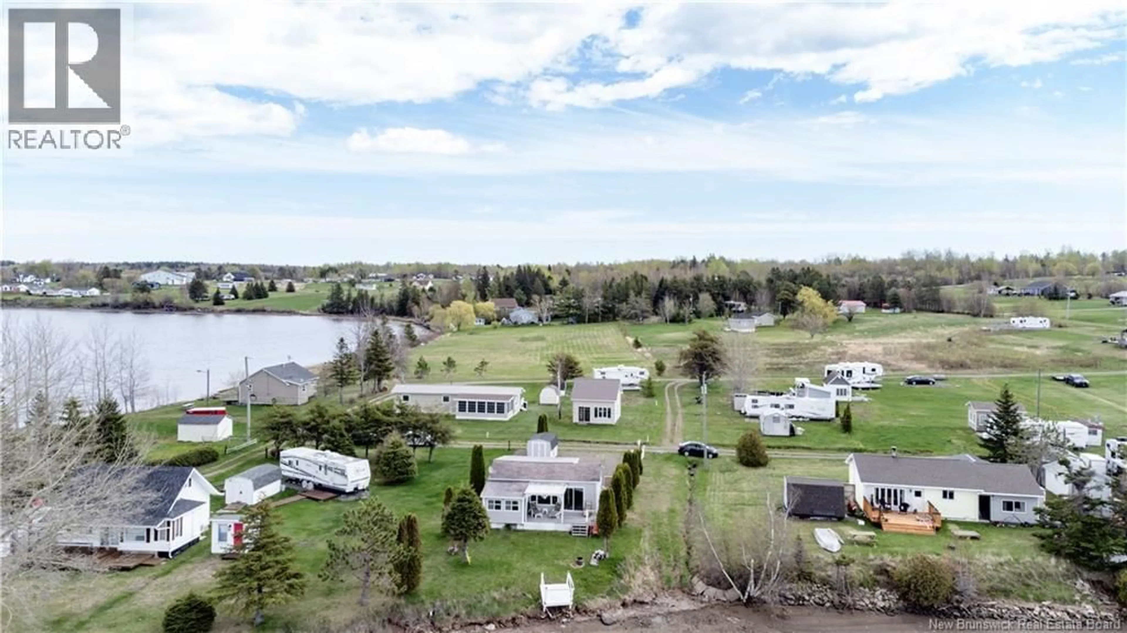 A pic from outside/outdoor area/front of a property/back of a property/a pic from drone, water/lake/river/ocean view for 49 ROBERT LANE, Bouctouche New Brunswick E4S5M7