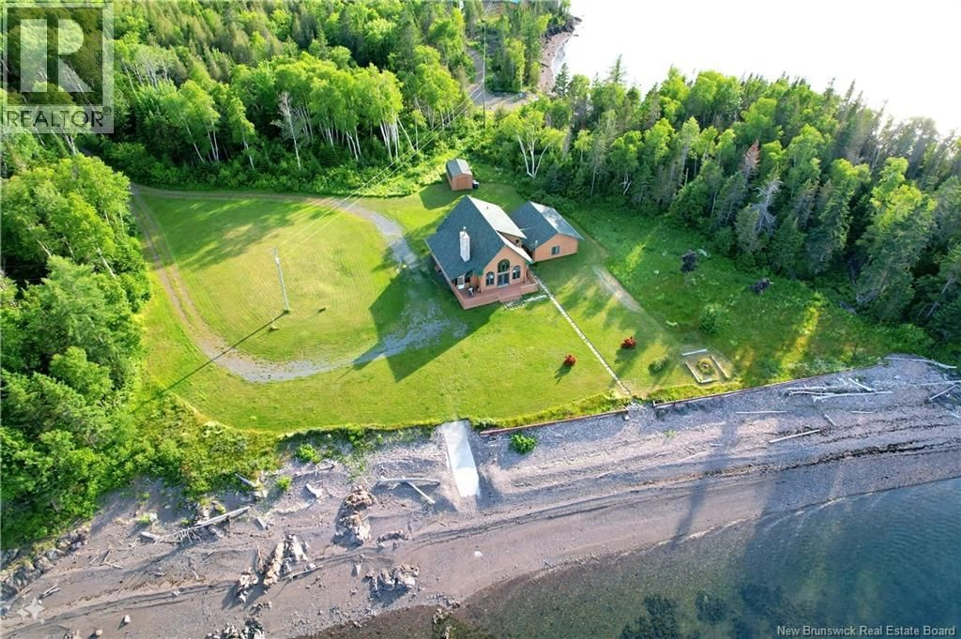 A pic from outside/outdoor area/front of a property/back of a property/a pic from drone, water/lake/river/ocean view for 41 MCNEIL, Sea Side New Brunswick E8G1T2