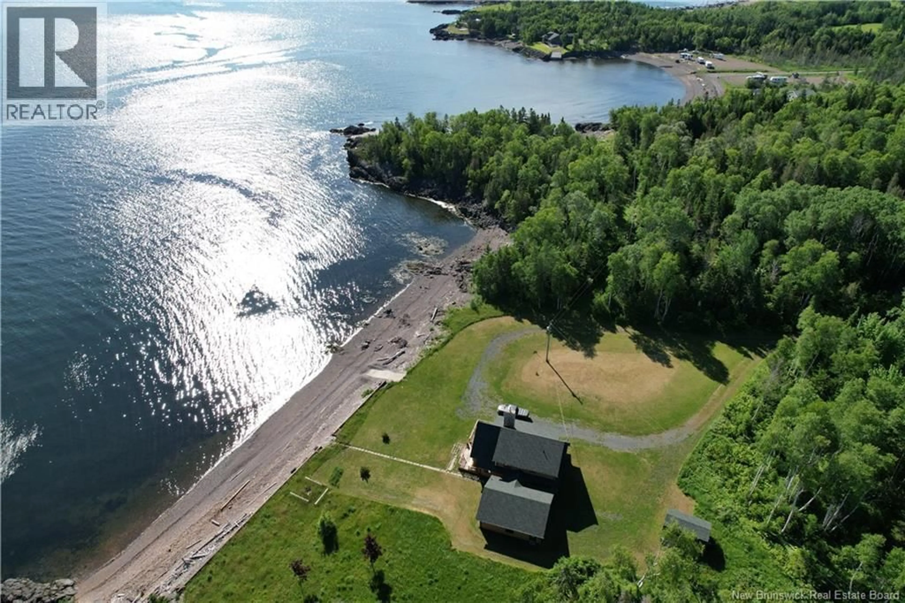 A pic from outside/outdoor area/front of a property/back of a property/a pic from drone, water/lake/river/ocean view for 41 MCNEIL, Sea Side New Brunswick E8G1T2