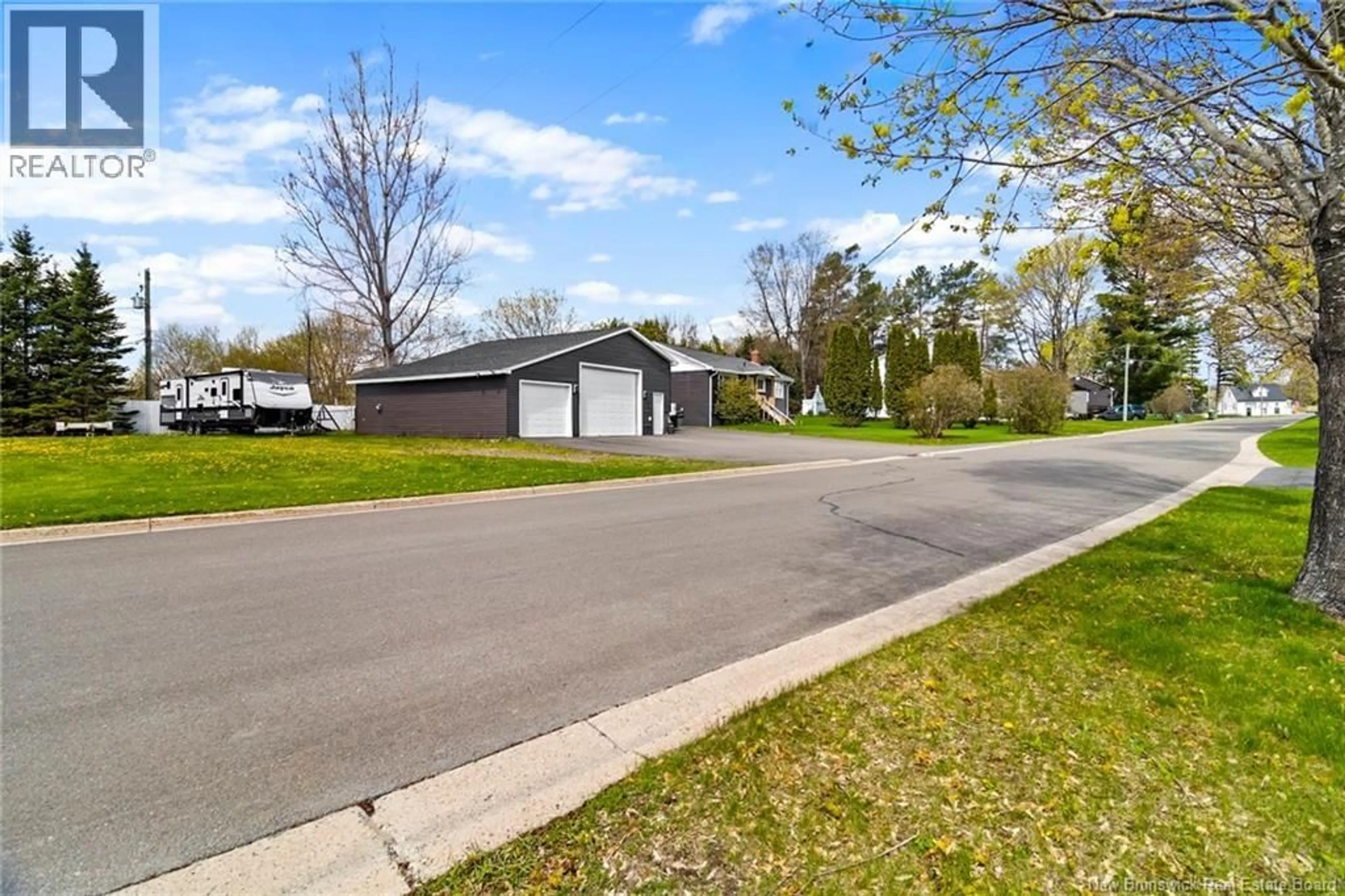 A pic from outside/outdoor area/front of a property/back of a property/a pic from drone, street for 210 MCNEILL AVENUE, Fredericton New Brunswick E3A1J6