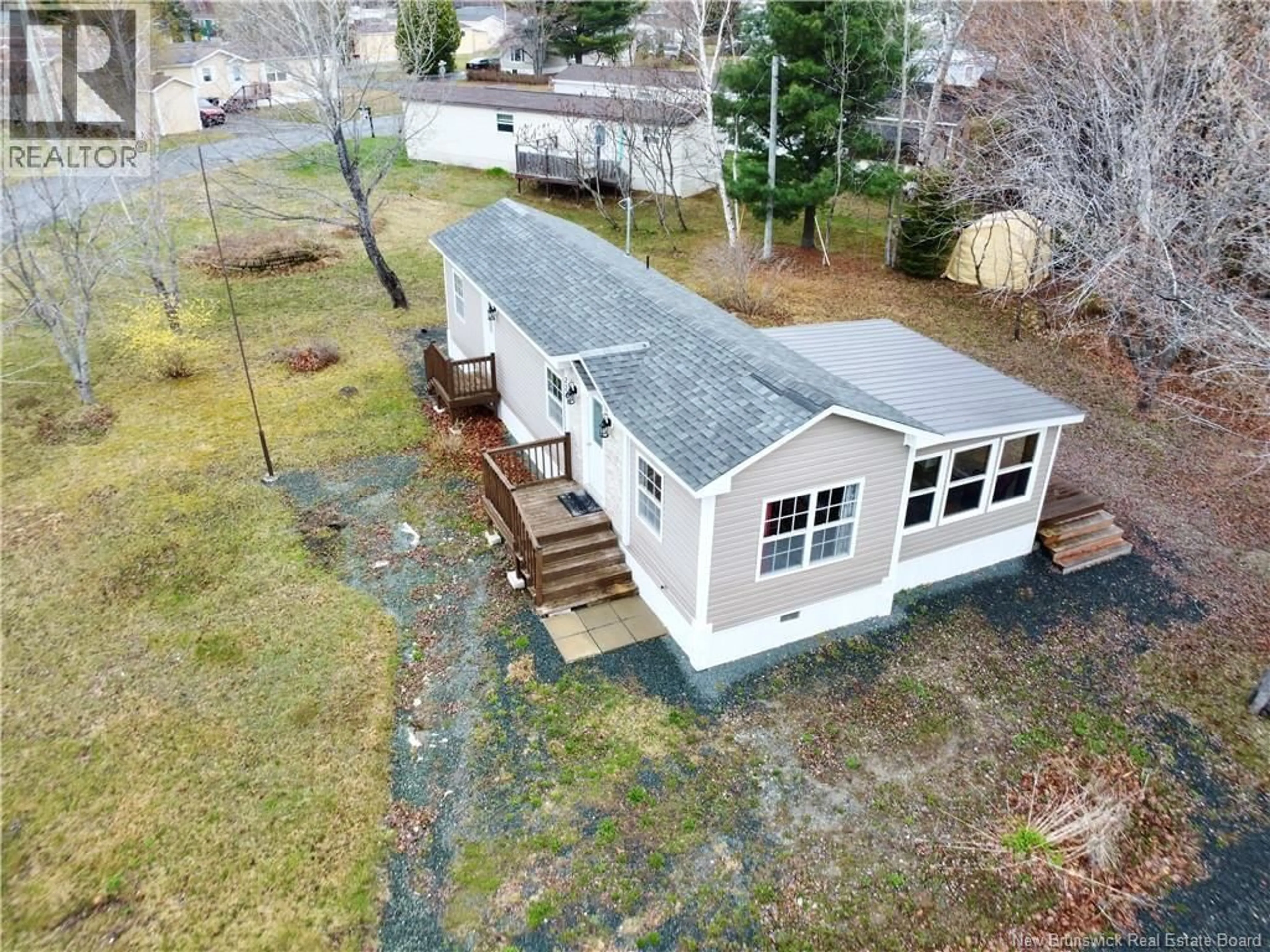 A pic from outside/outdoor area/front of a property/back of a property/a pic from drone, unknown for 224 BIRCHGROVE DRIVE, Beresford New Brunswick E8K1G4