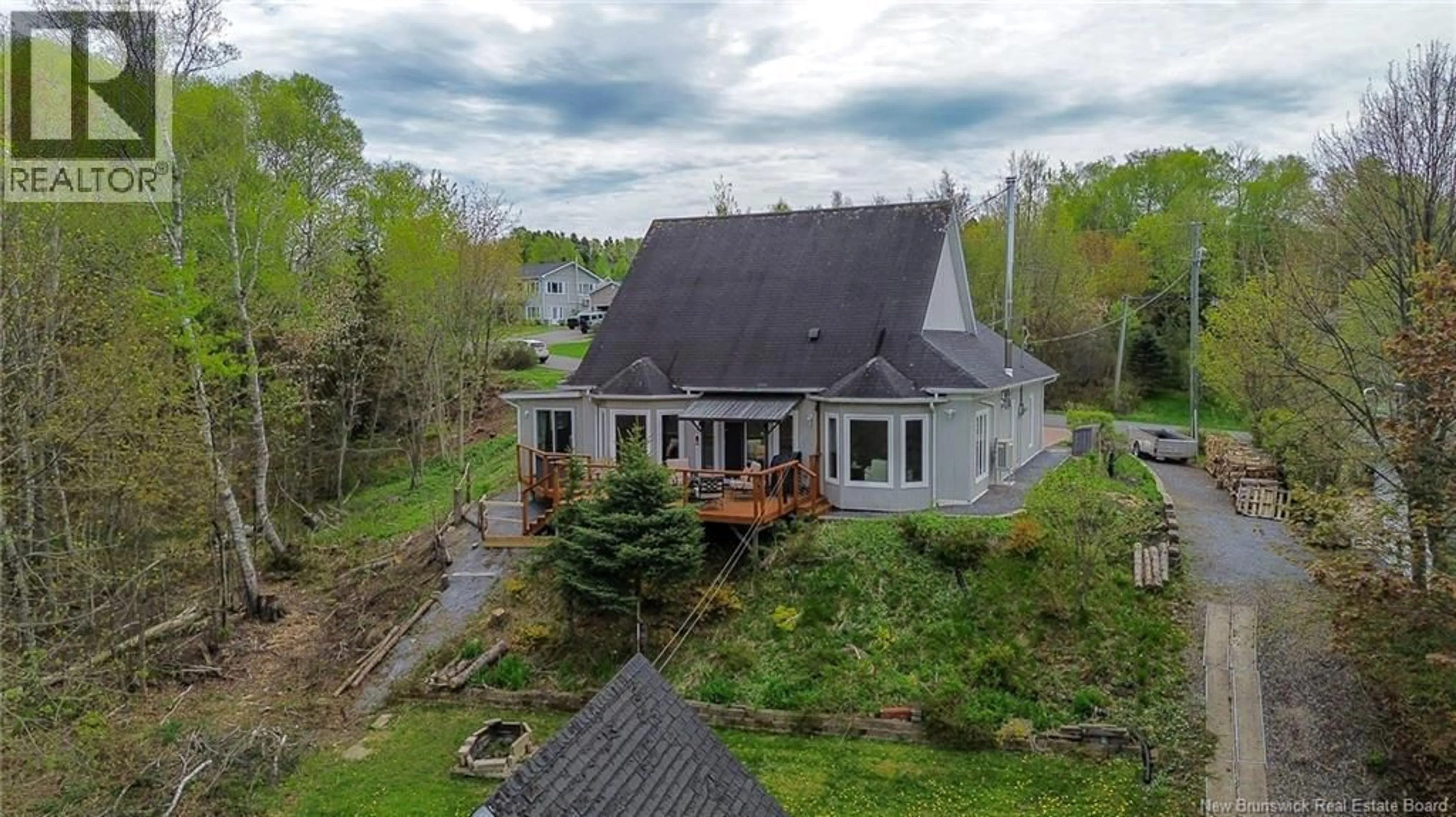 A pic from outside/outdoor area/front of a property/back of a property/a pic from drone, water/lake/river/ocean view for 27 SUNSET CRESCENT, Grand Bay-Westfield New Brunswick E5K2W3