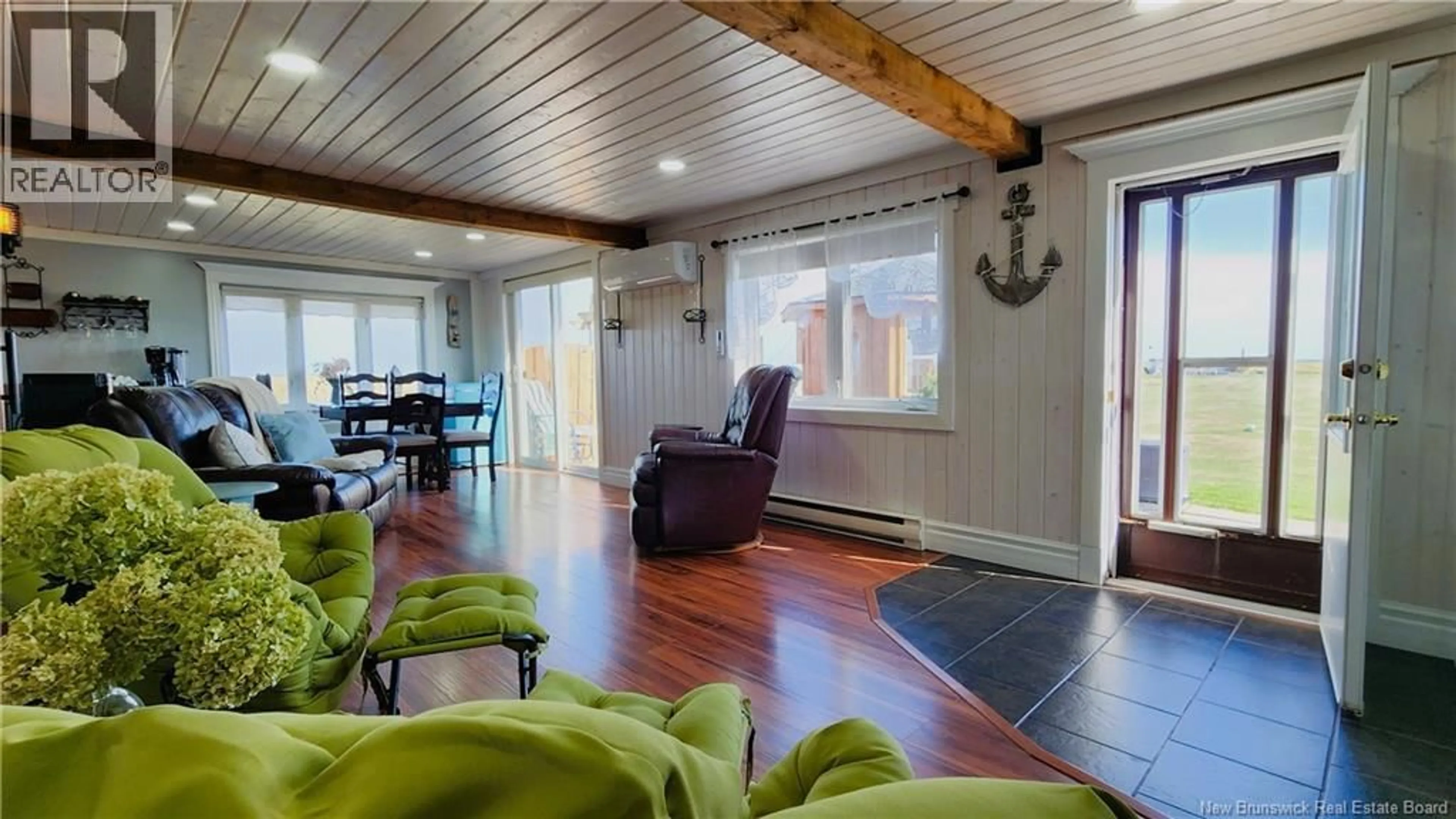 Living room with furniture, wood/laminate floor for 1645 CH. WILSON POINT, Miscou New Brunswick E8T2G8
