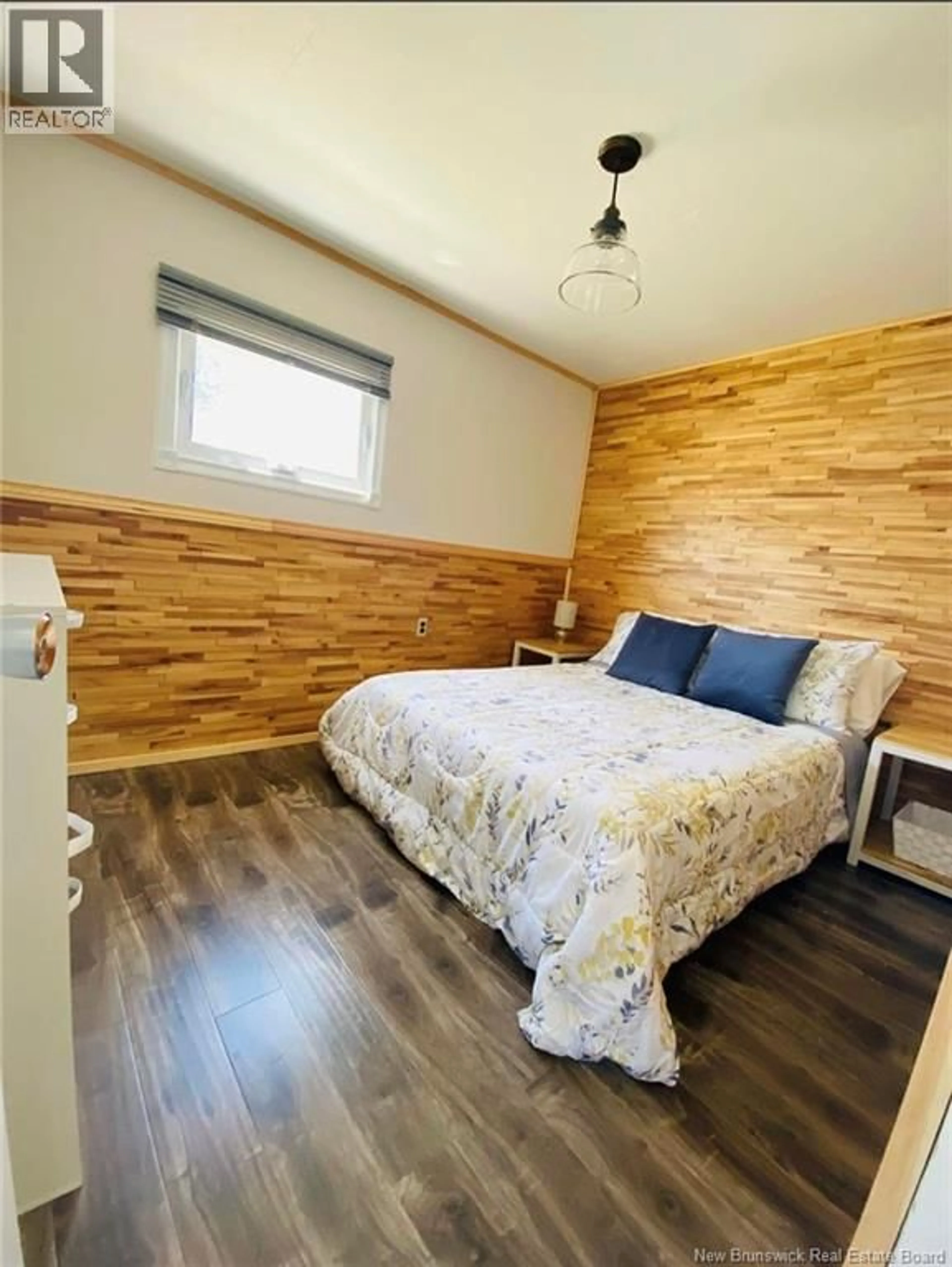 Bedroom with bed, wood/laminate floor for 21 AMI SOLEIL LANE, Pointe-Alexandre New Brunswick E8T1V0