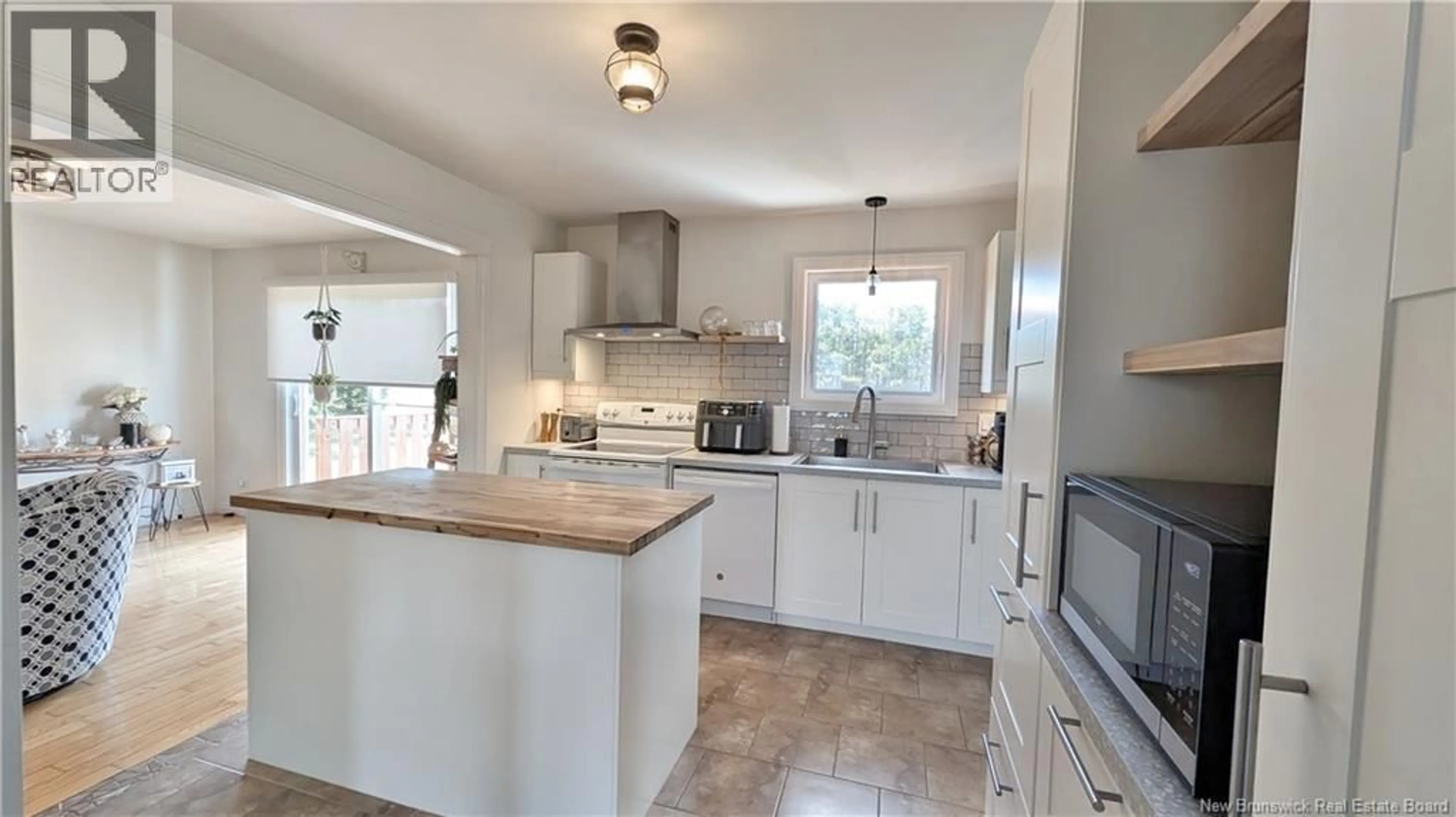 Open concept kitchen, ceramic/tile floor for 739 CHEM. F X BRIDEAU, Saumarez New Brunswick E1X2L9