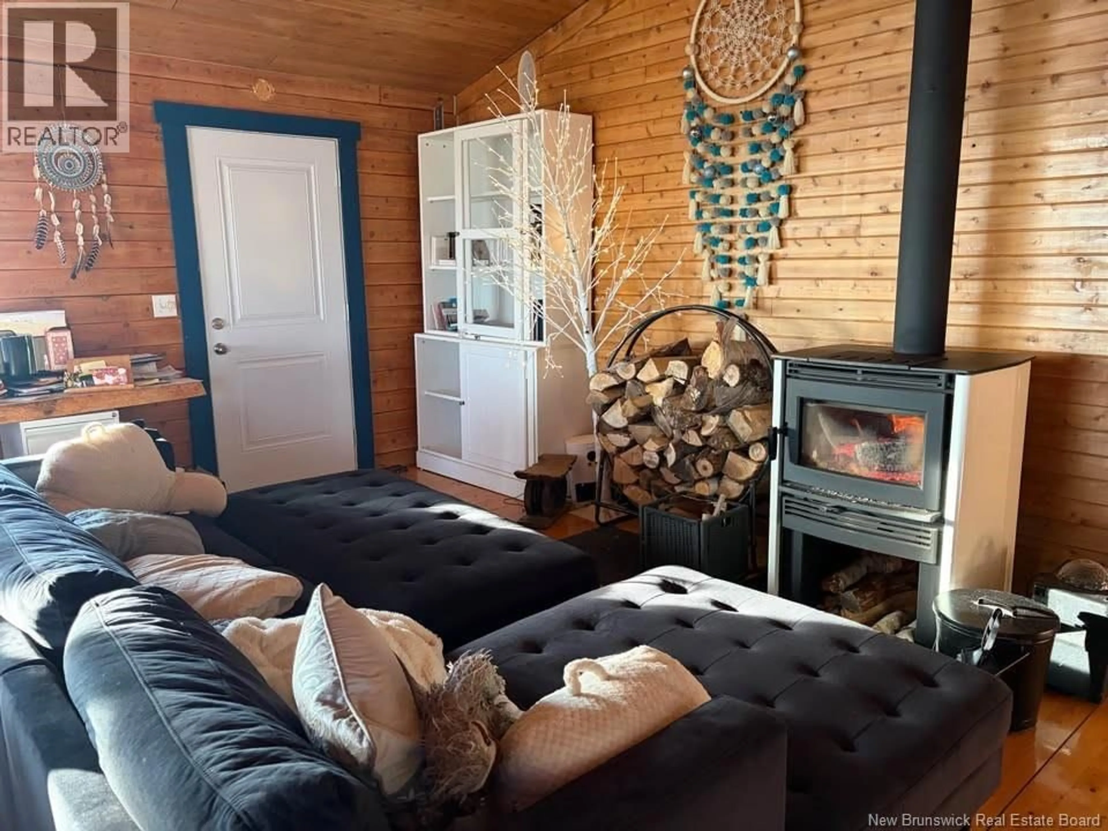 Living room with furniture, wood/laminate floor for 27 JANEVILLE BEACH ROAD, Janeville New Brunswick E2A5K3