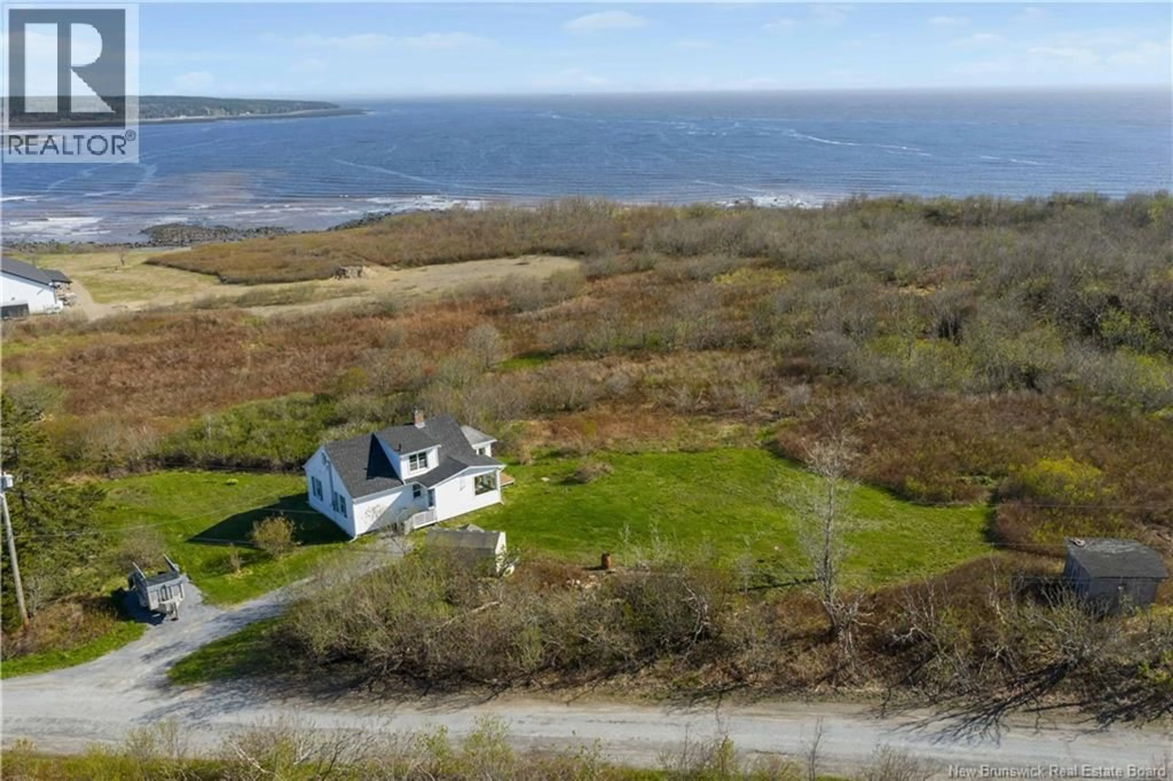 A pic from outside/outdoor area/front of a property/back of a property/a pic from drone, water/lake/river/ocean view for 21 OLD RED HEAD ROAD, Saint John New Brunswick E2P1J6