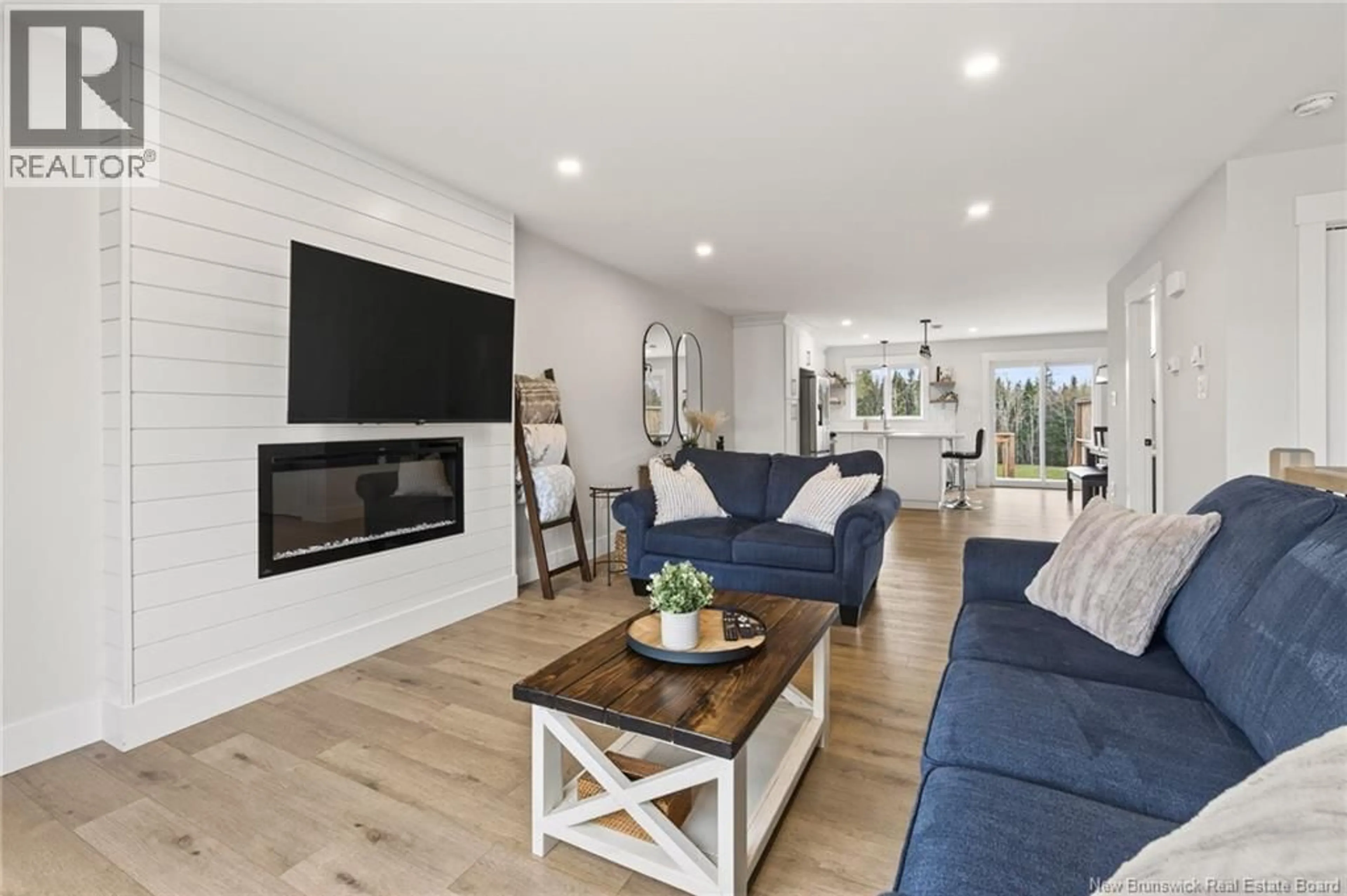 Living room with furniture, wood/laminate floor for 104 ELSLIGER, Dieppe New Brunswick E1K0A5