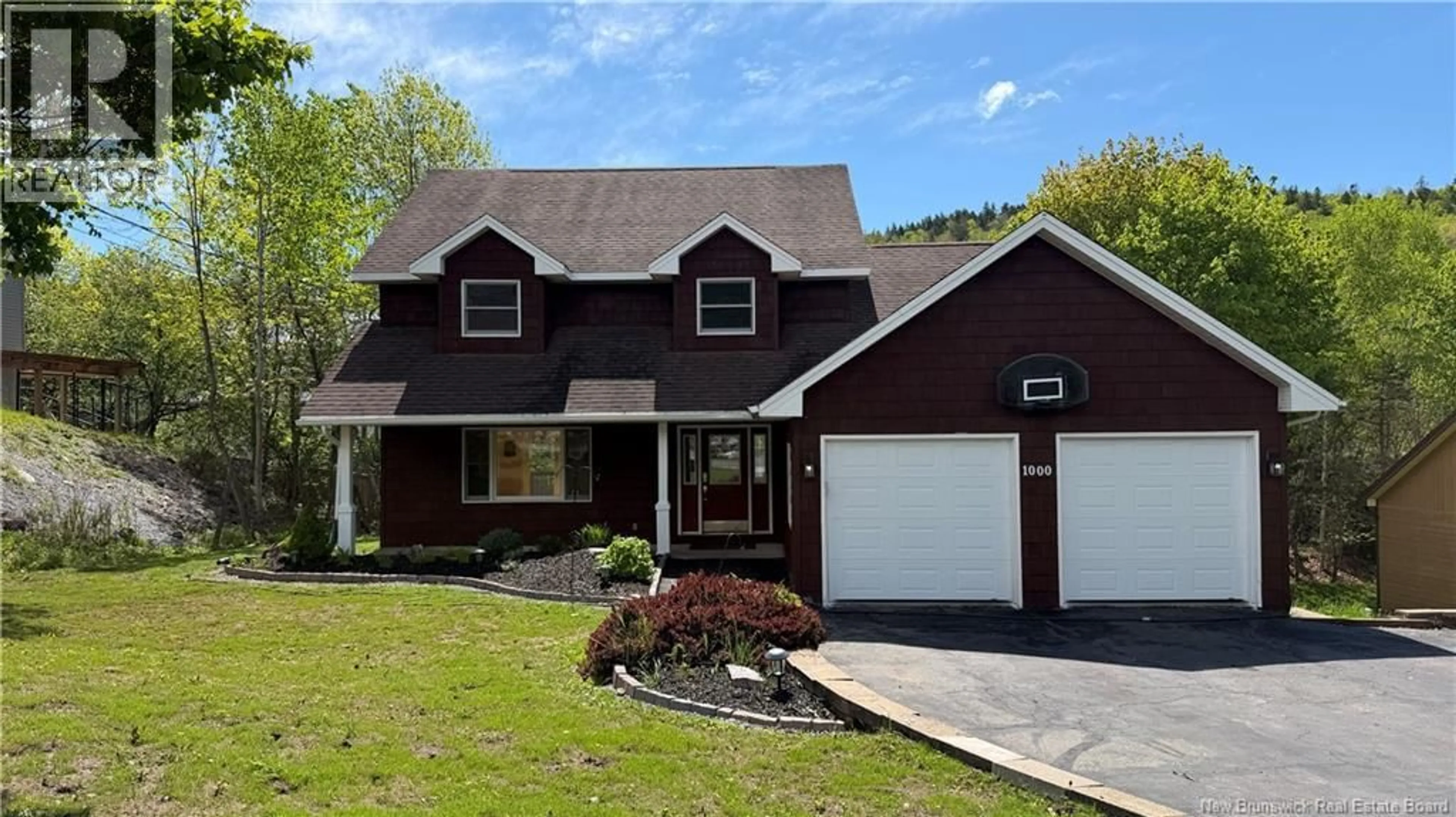 Home with vinyl exterior material, street for 1000 KENNEBECASIS DRIVE, Saint John New Brunswick E2K5A9