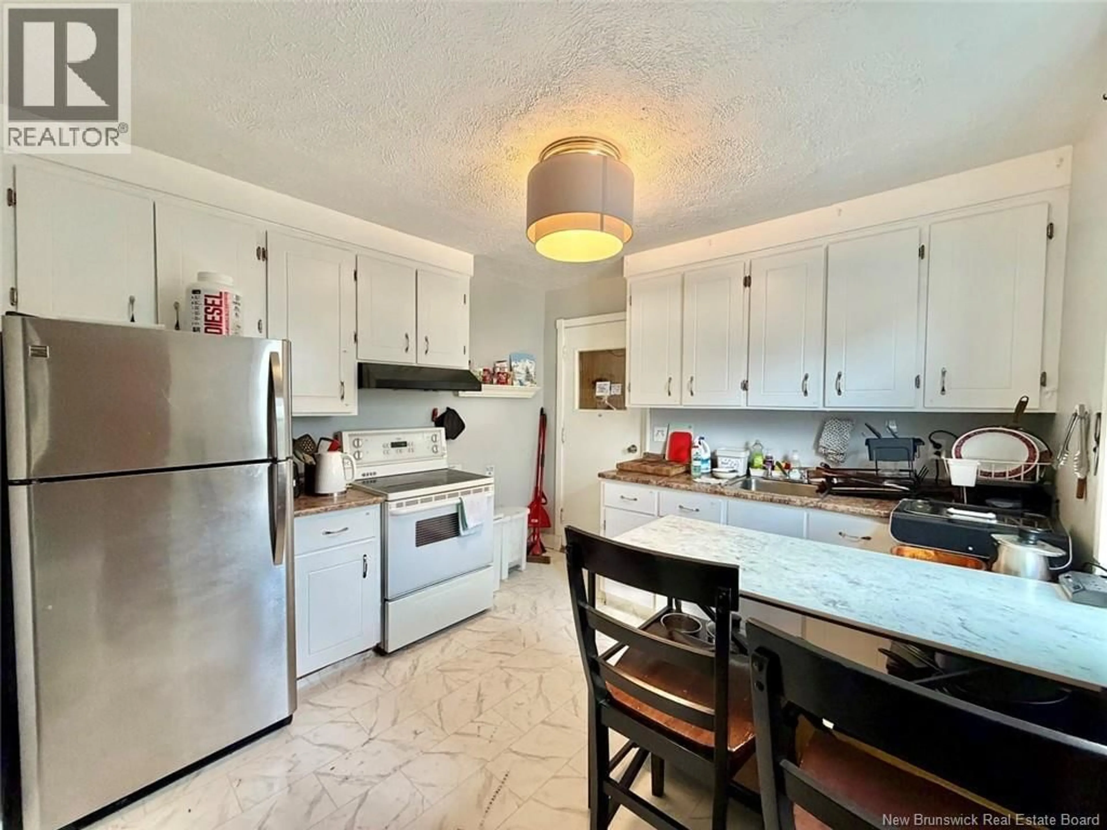 Open concept kitchen, ceramic/tile floor for 40 MCDOUGALL AVENUE, Moncton New Brunswick E1C6A9