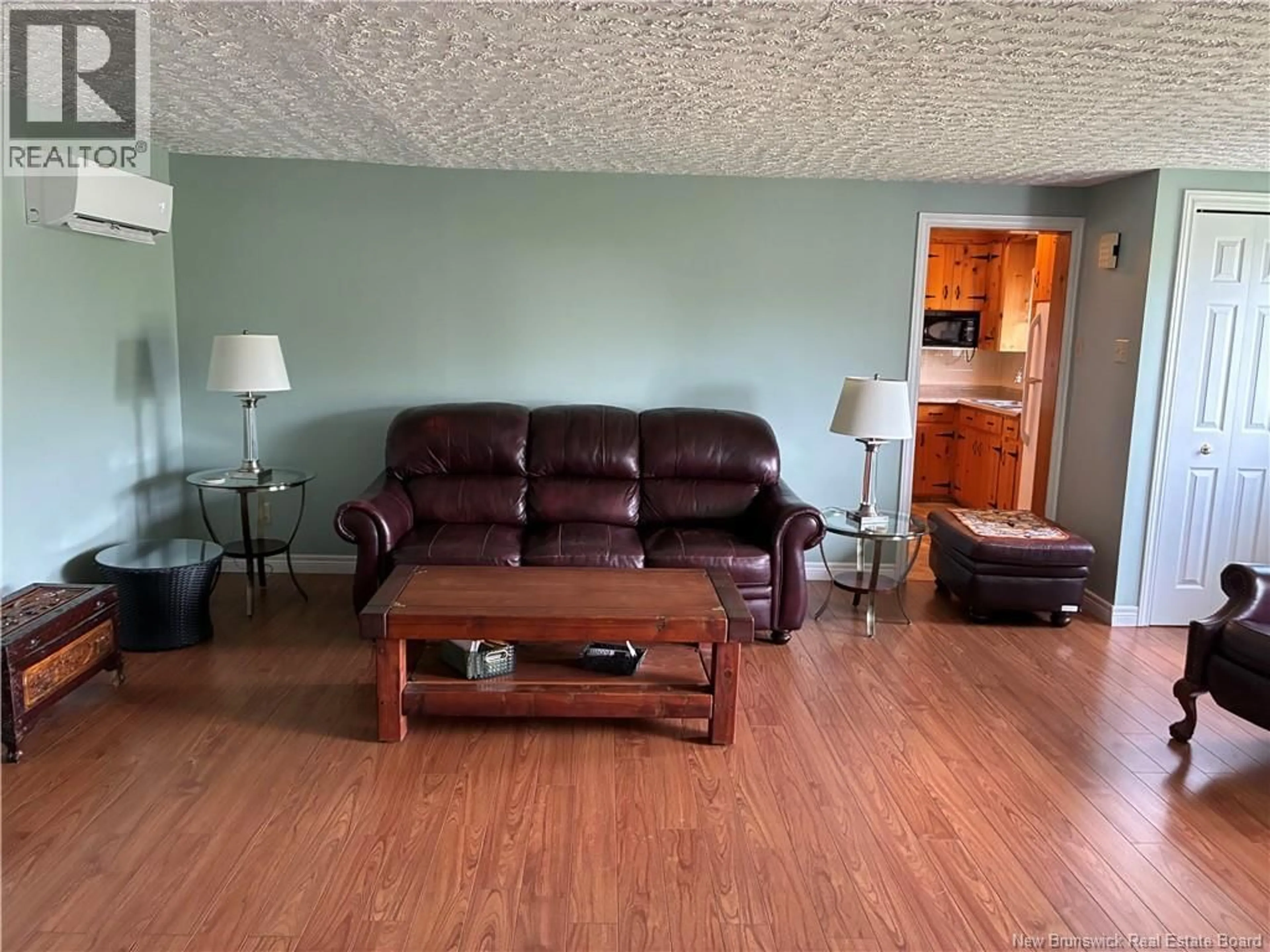 Living room with furniture, wood/laminate floor for 186 KILLAM ROAD, Killams Mills New Brunswick E4Z2X6