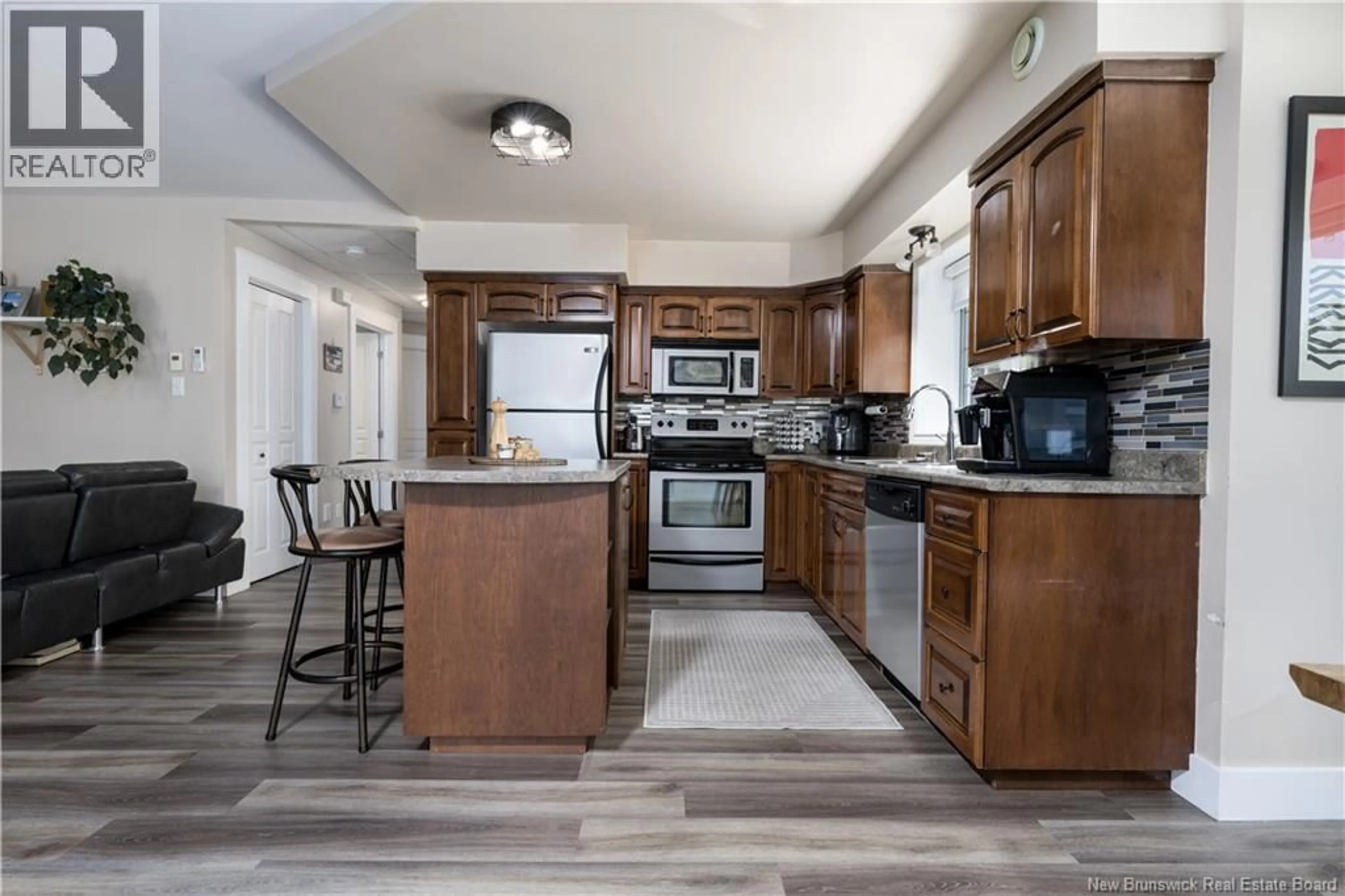 Open concept kitchen, ceramic/tile floor for 4 - 31 HARRISON STREET, Grand-Sault/Grand Falls New Brunswick E3Z0B3