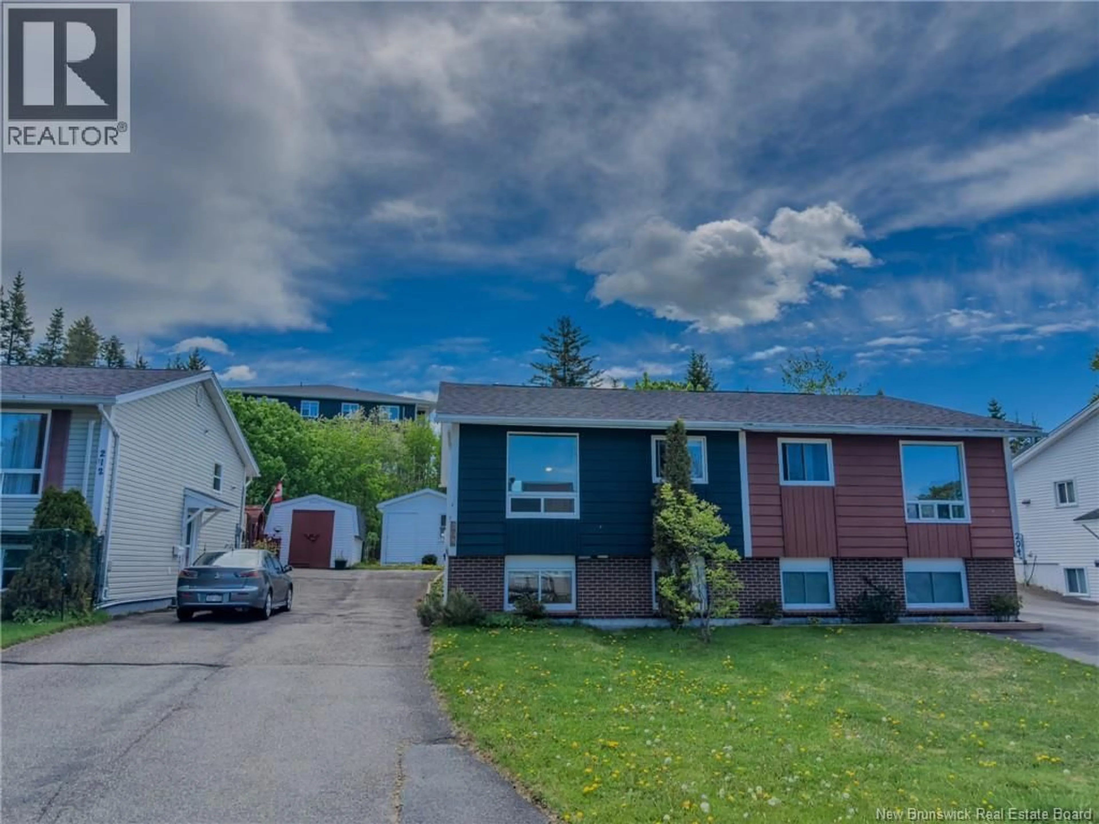 A pic from outside/outdoor area/front of a property/back of a property/a pic from drone, street for 208 BOYANER CRESCENT, Saint John New Brunswick E2J4C4