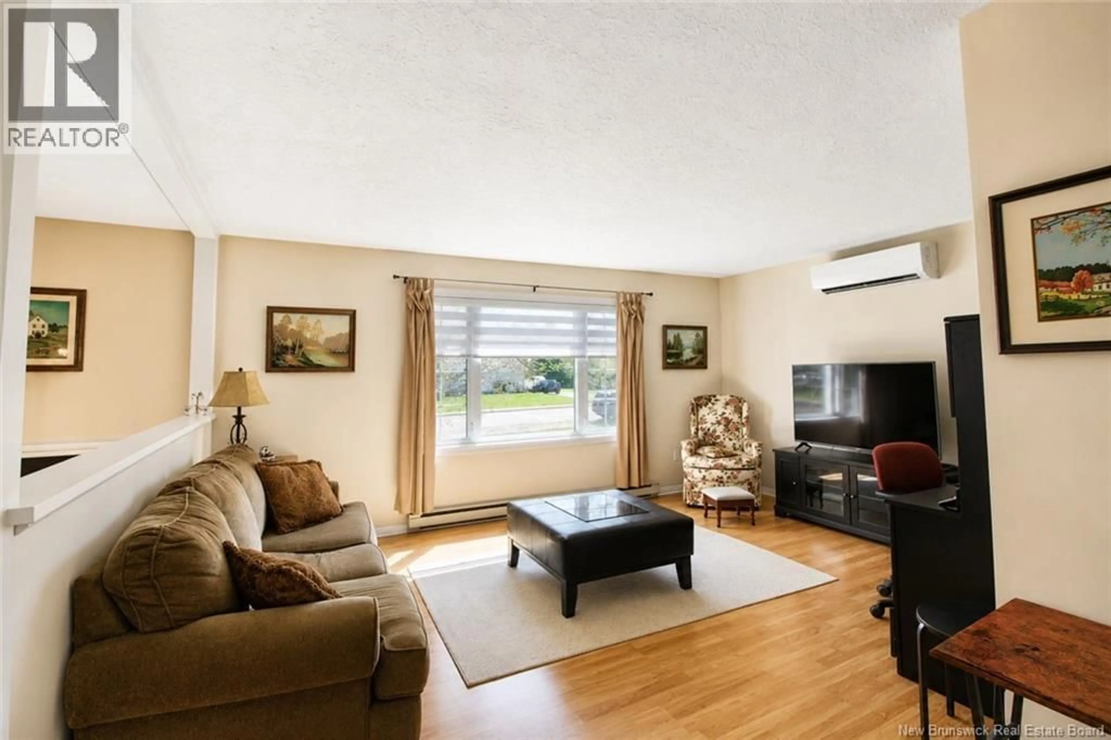 Living room with furniture, wood/laminate floor for 21 HUTCHINSON LANE, Rexton New Brunswick E4W1Y8