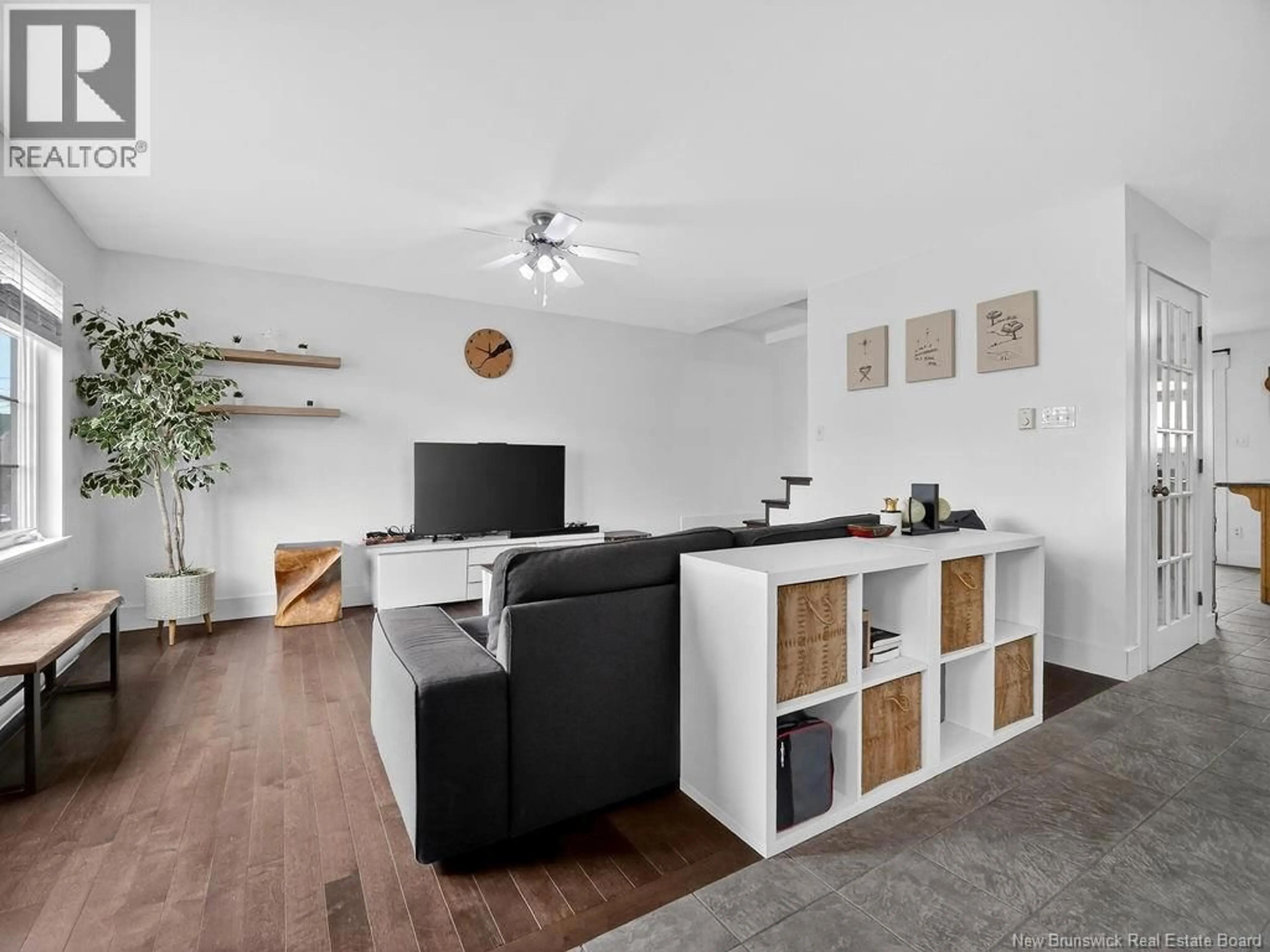 Living room with furniture, wood/laminate floor for 94 HAMPTON STREET, Moncton New Brunswick E1G5H1