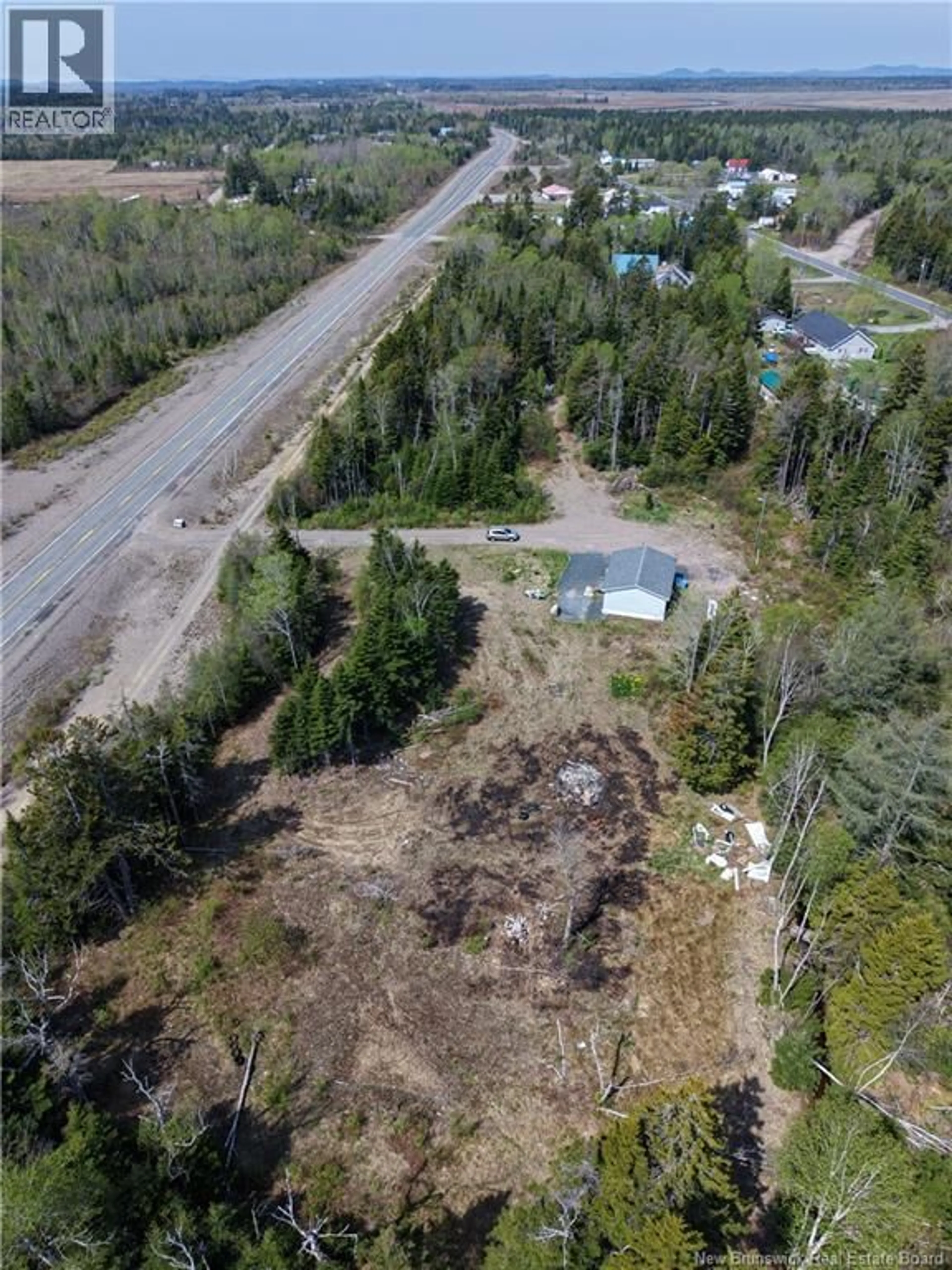 A pic from outside/outdoor area/front of a property/back of a property/a pic from drone, unknown for 653 ROUTE 175, Pennfield New Brunswick E5H0B5