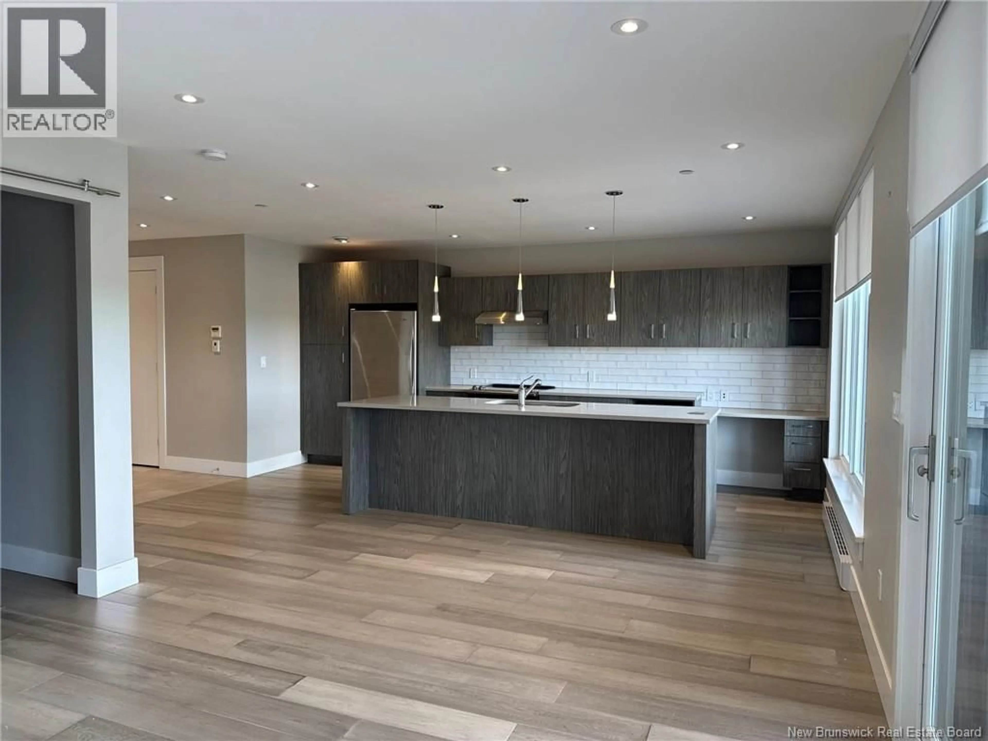 Open concept kitchen, wood/laminate floor for 704 - 55 QUEEN STREET, Moncton New Brunswick E1C4S5