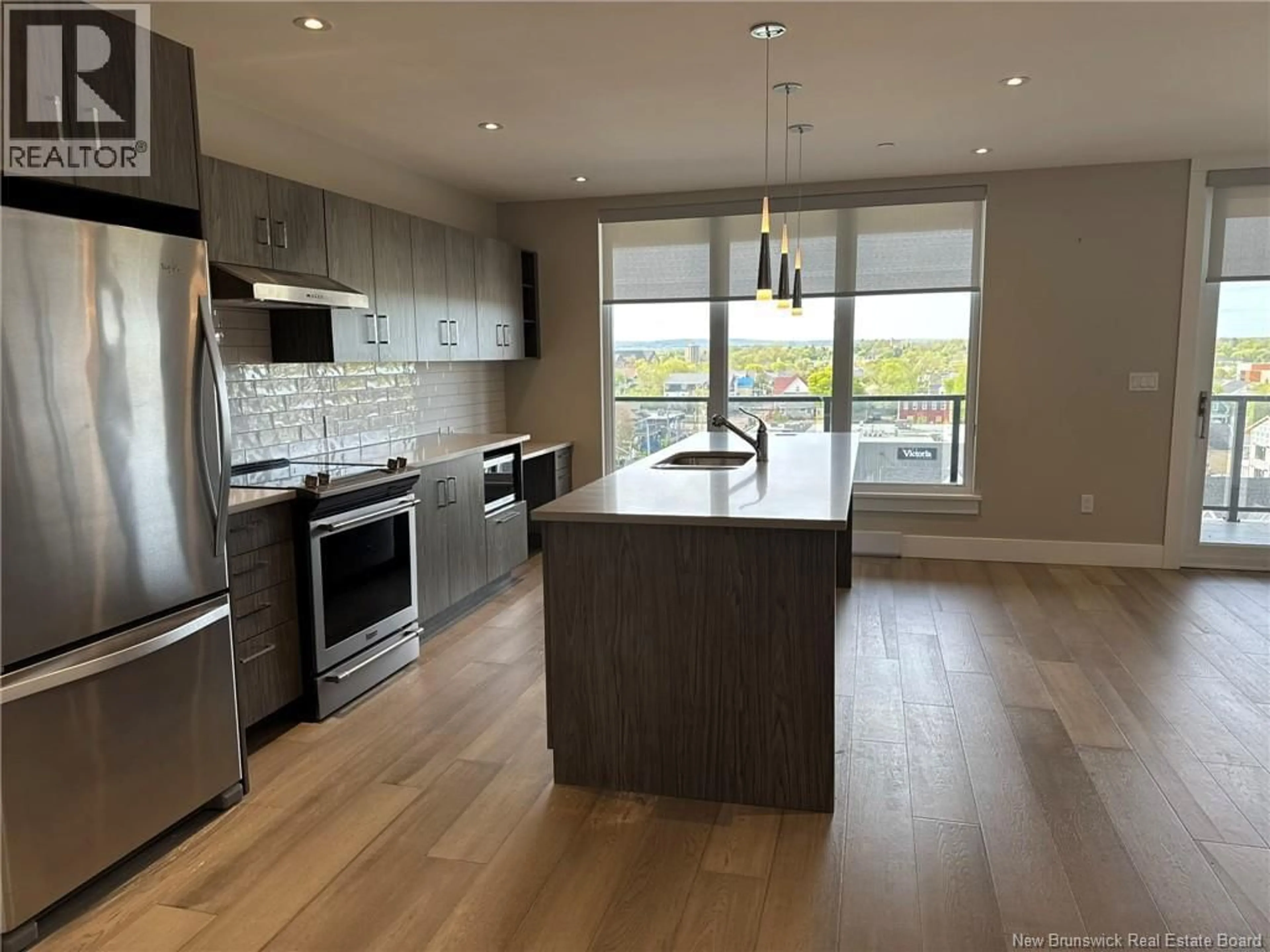 Open concept kitchen, wood/laminate floor for 704 - 55 QUEEN STREET, Moncton New Brunswick E1C4S5