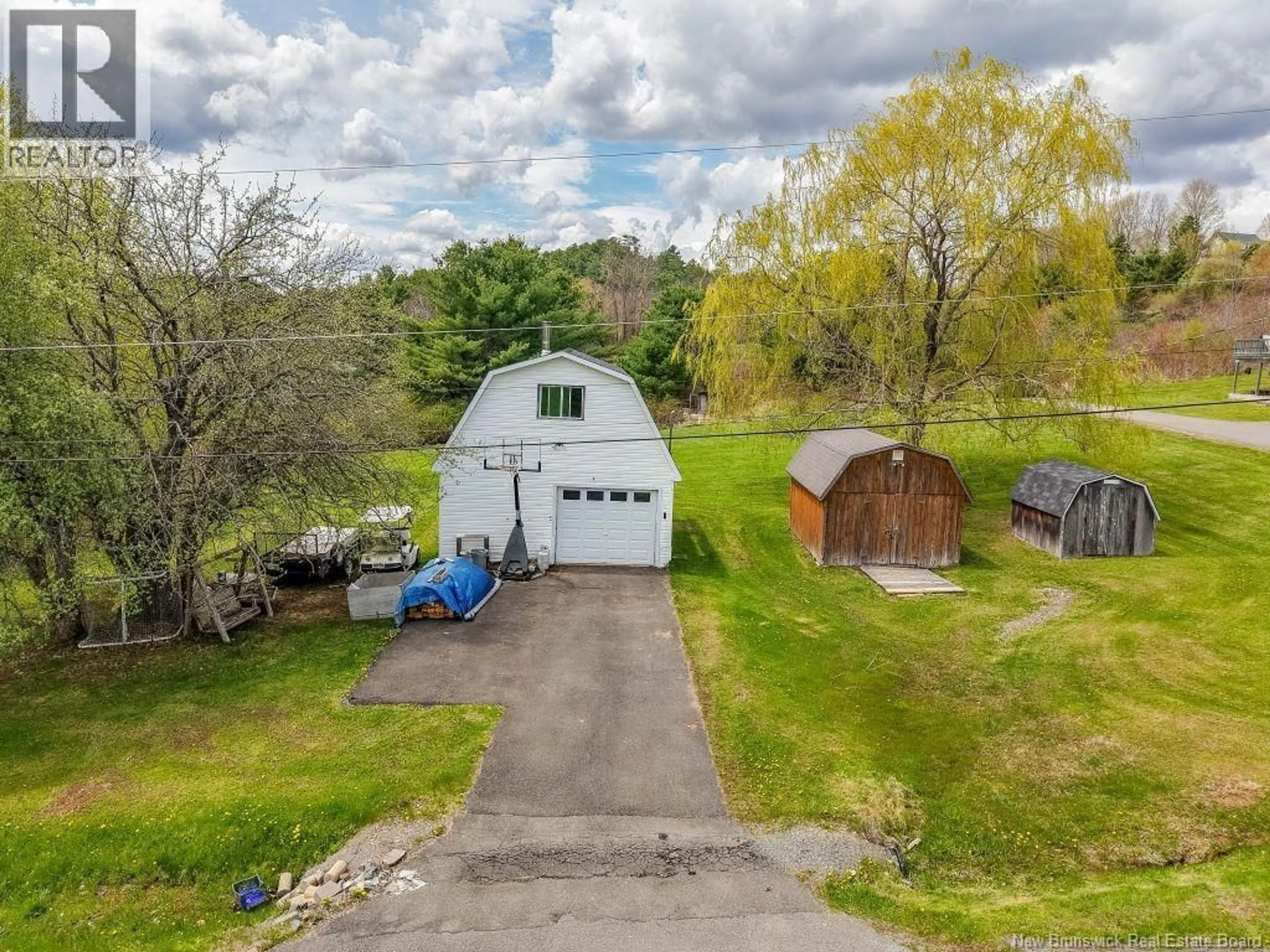 A pic from outside/outdoor area/front of a property/back of a property/a pic from drone, water/lake/river/ocean view for 11 GRAMPS LANE, Douglas New Brunswick E3G7J5